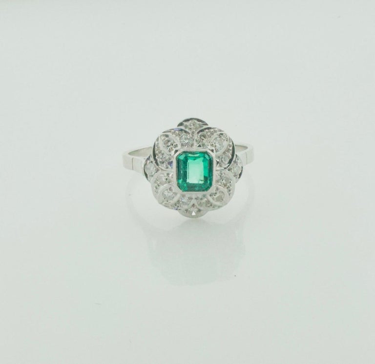 Emerald Cut Art Deco Emerald and Diamond Ring in Platinum For Sale