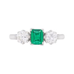 Art Deco Emerald and Diamond Three-Stone Engagement Ring, circa 1920s