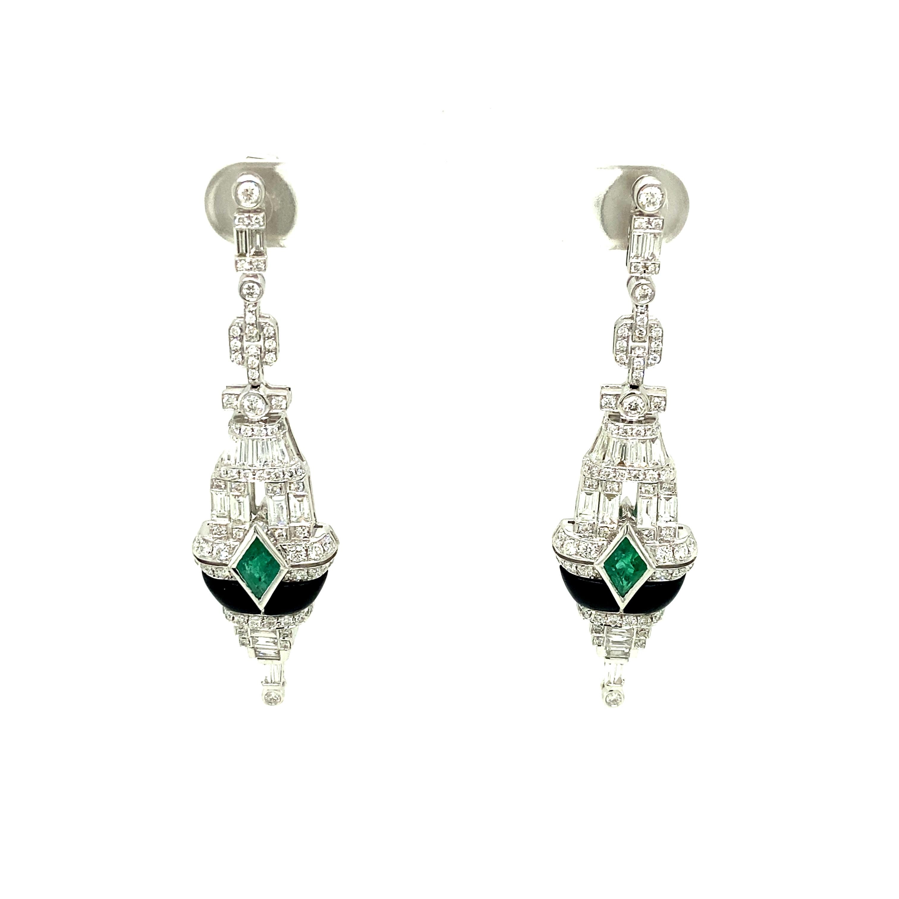 Art-Deco Style Emerald, Black Onyx, and White Diamond Gold Dangle Earrings:

A beautiful pair of earrings, it features two kite shaped emeralds weighing 3.63 carat, with a stunning arrangement of white diamonds weighing 2.23 carat, and tubular black