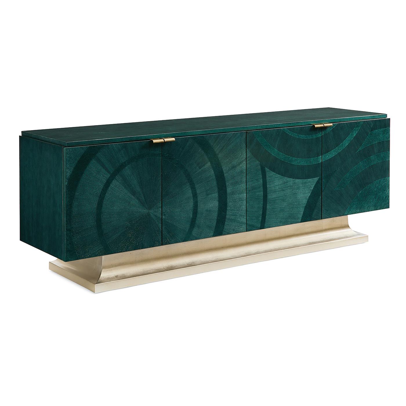 This glamorous Art Deco cabinet is a stunning statement-maker. This impressive media cabinet console is distinguished by an Art Deco-inspired pattern brought to life in a bold shade of Emerald Peacock over Koto veneers and Bird's Eye Maple inlays. A