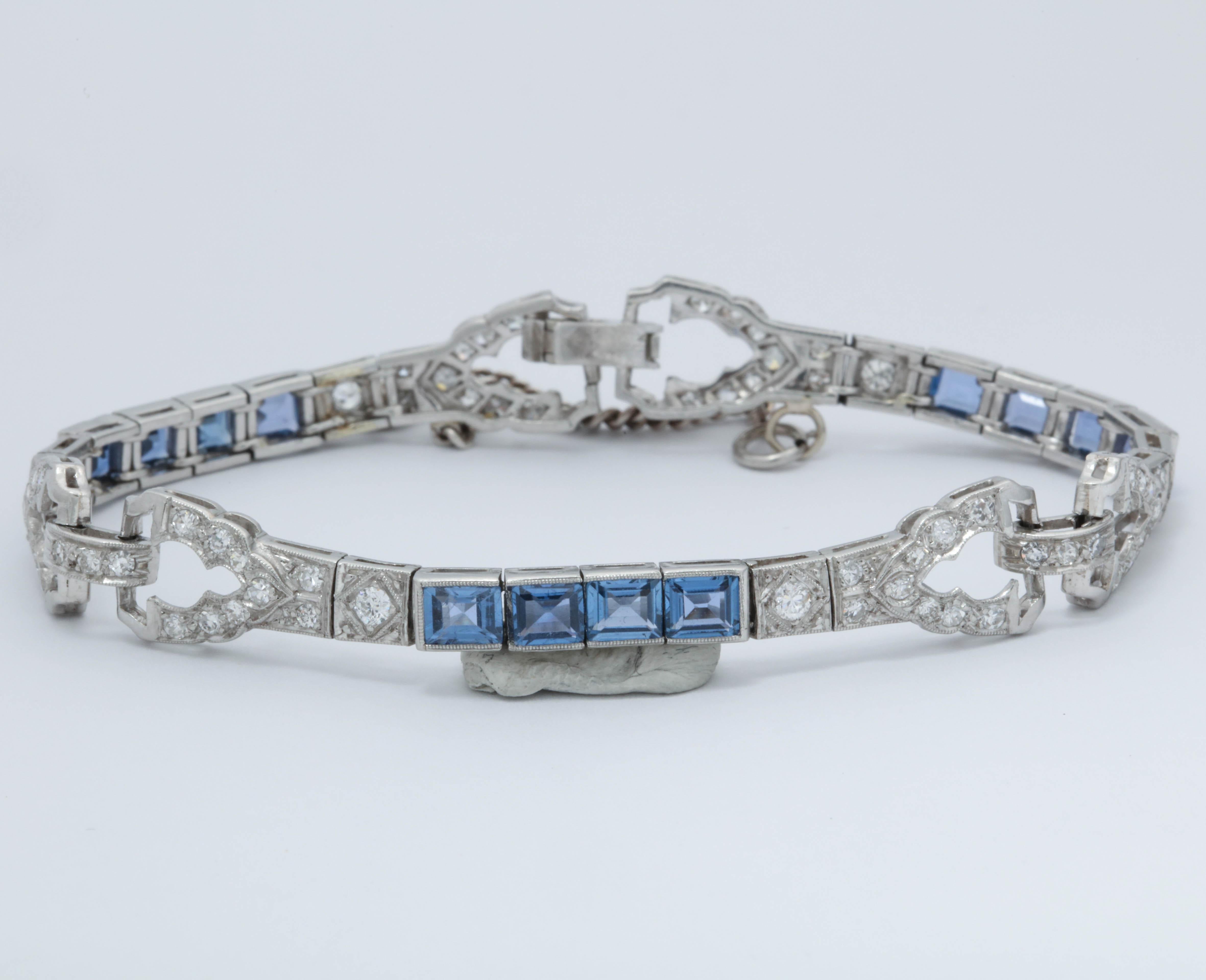 One Ladies Flexible Platinum Link Bracelet Designed With {12} Emerald Cut Ceylon Color Sapphires Weighing Approximately 3 Carats Total Weight. Flexible Link Bracelet Is Further Designed With Numerous Antique Diamonds Weighing Approximately 2.50 cts