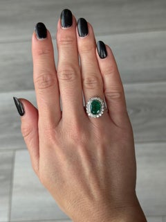 Art Deco Emerald, Diamond and 14 Carat White Gold Cluster Panel Ring