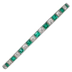 Bracelet de ligne Art Déco en émeraude, diamant et platine, vers 1925