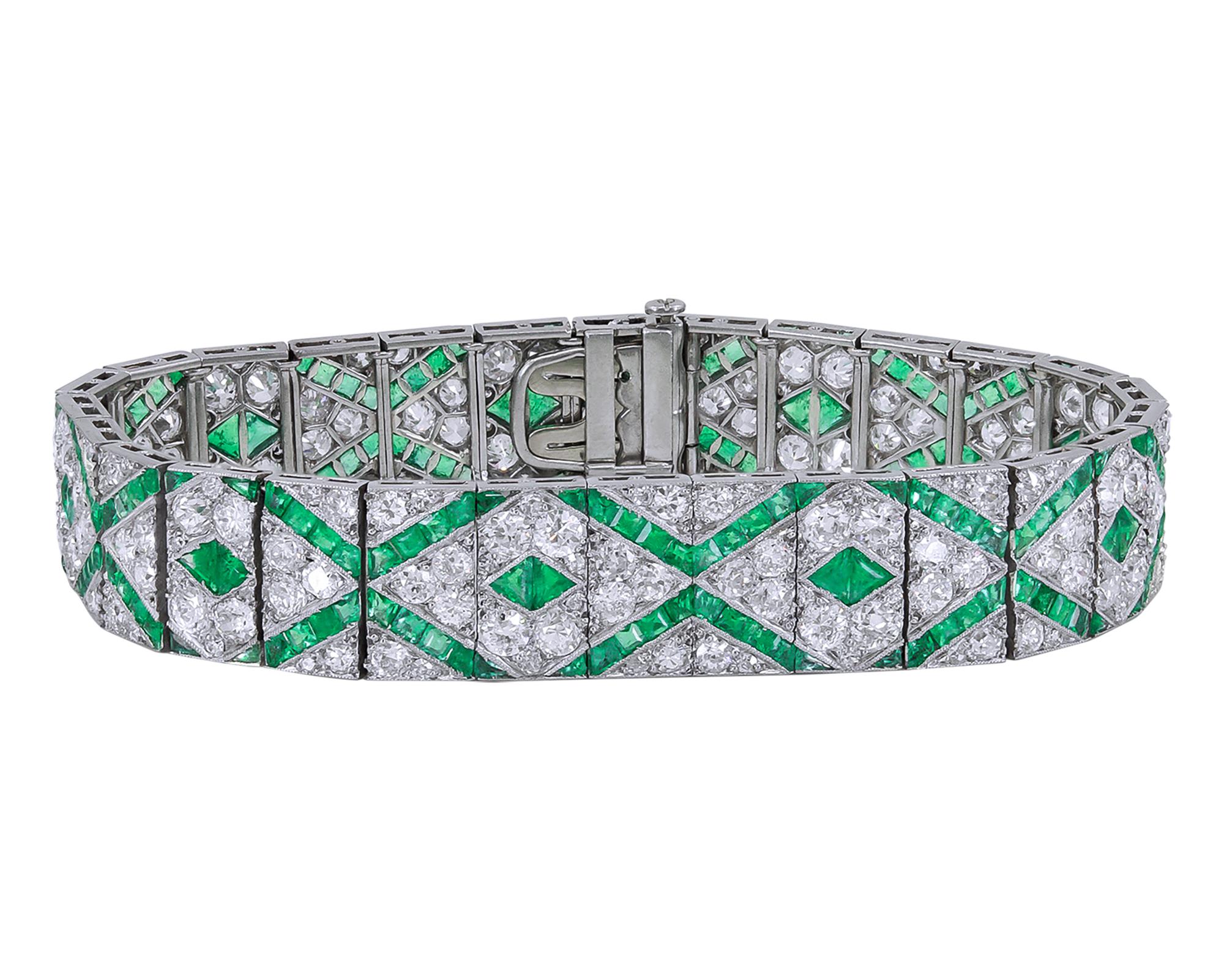A gorgeous bracelet from the Art Deco period comprising of the emeralds and diamonds. French made.
The diamonds are old European cut weighing approximately 13.00 carats. 
The emeralds are mixed cut weighing approximately 5 carats. 
The metal is