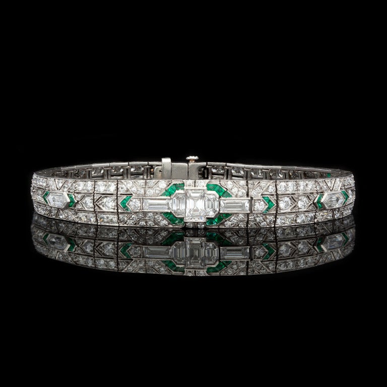 Art Deco Diamond & Emerald Bracelet features 225 Mixed Cut Diamonds for approximately 7.04cts & 38 Emeralds set in Platinum.  Bracelet measures 7 inches long and 5-9mm in width, with a weight of 24.2 grams. Circa 1920's, the quality of craftsmanship