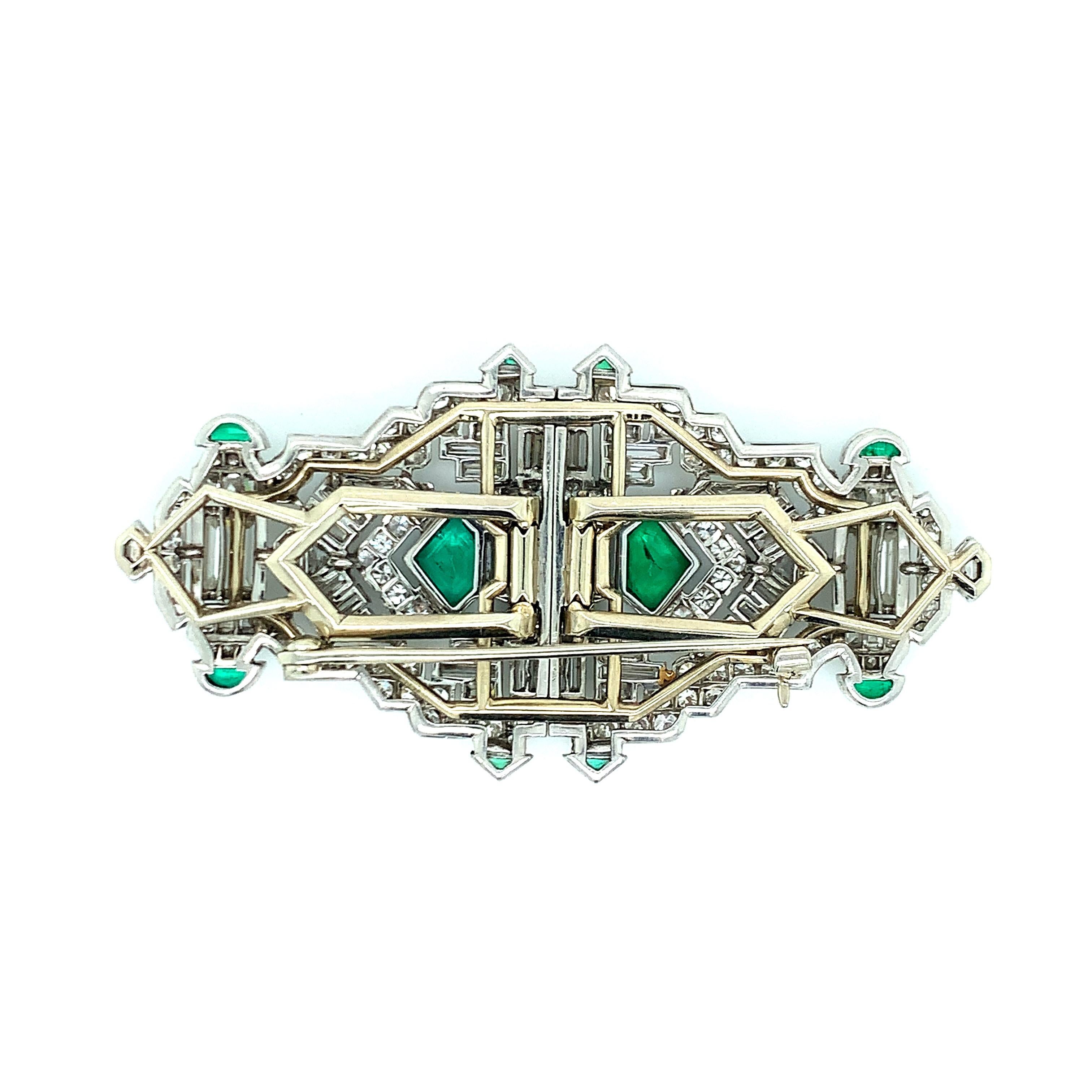 A well-made platinum Colombian emerald diamond double-clip brooch that consists of approximately 9 carats of diamonds and approximately 2.5 carats of emeralds. Comes with an AGL emerald report. 
