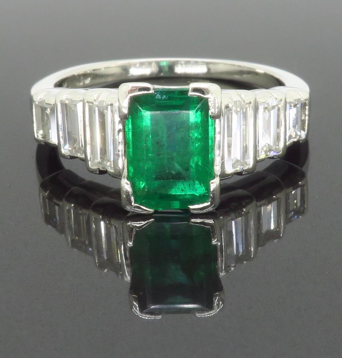 Exquisite Art Deco Emerald and Baguette cut diamond ring made in Platinum 

Gemstone: Emerald & Diamond
Gemstone Carat Weight: 1.05CT
Diamond Carat Weight:  0.40CTW
Diamond Cut: Straight Baguette Cut 
Color: E-F
Clarity: VS-VVS
Metal: Platinum 
Ring