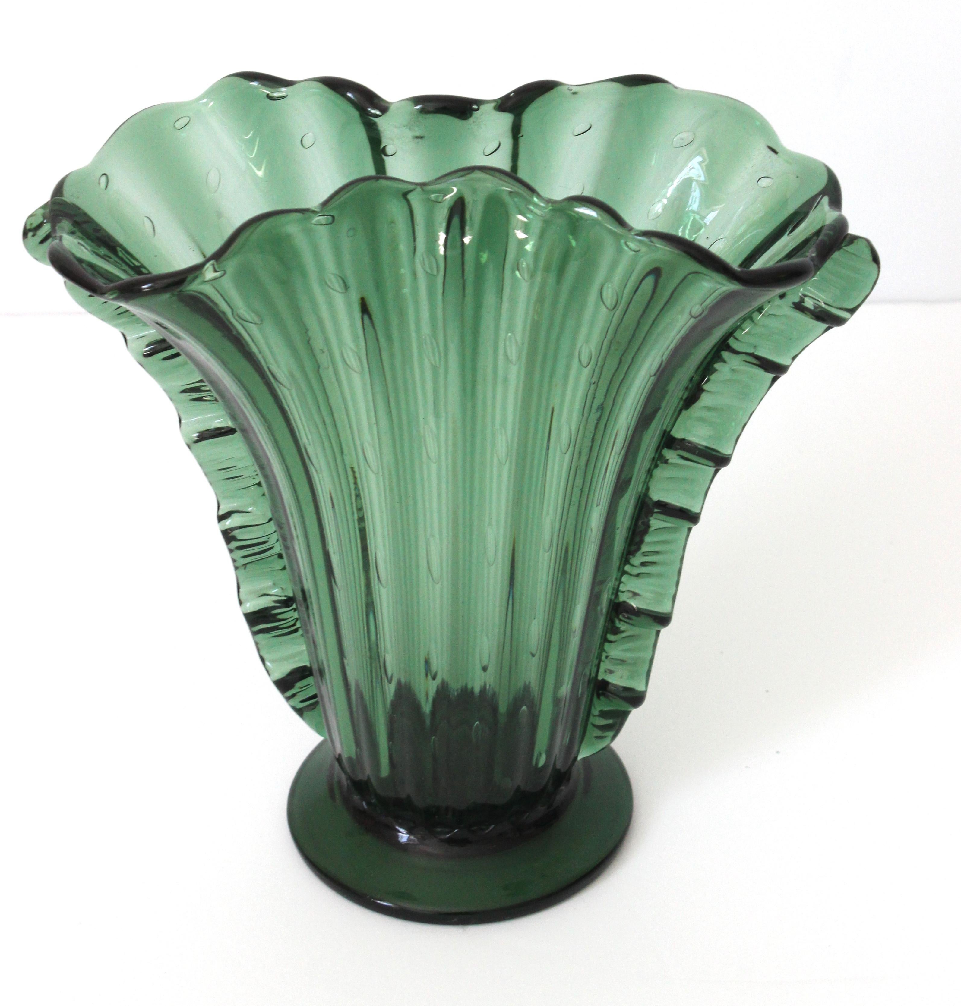 This stylish and rare dark emerald coloration of a classic Barovier et Toso, Murano glass fan-form vase dates to the 1930s.

 