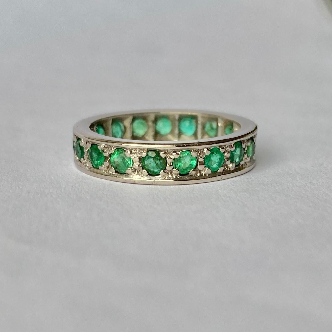 This gorgeously simple emerald full eternity band holds a gorgeous stones which reflect the light beautifully. The stones total approx 1.5carat. 

Ring Size: K 1/2 or 5 1/2 
Band Width: 4mm

Weight: 3.9g