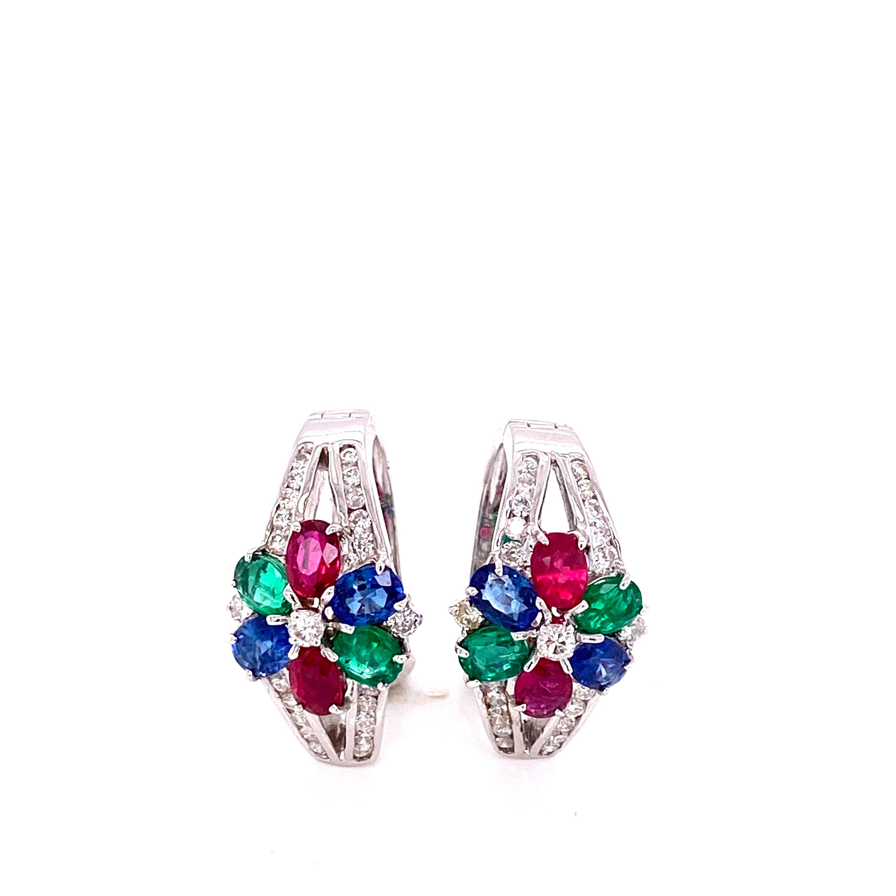 Art-Deco Style Emerald, Ruby, Blue Sapphire, and White Diamond Earrings:

A gorgeous pair of earrings, it features 0.86 carat of rubies, 0.74 carat of sapphires, 0.56 carat of emeralds, and 0.59 carat of white round brilliant diamonds. The rubies,