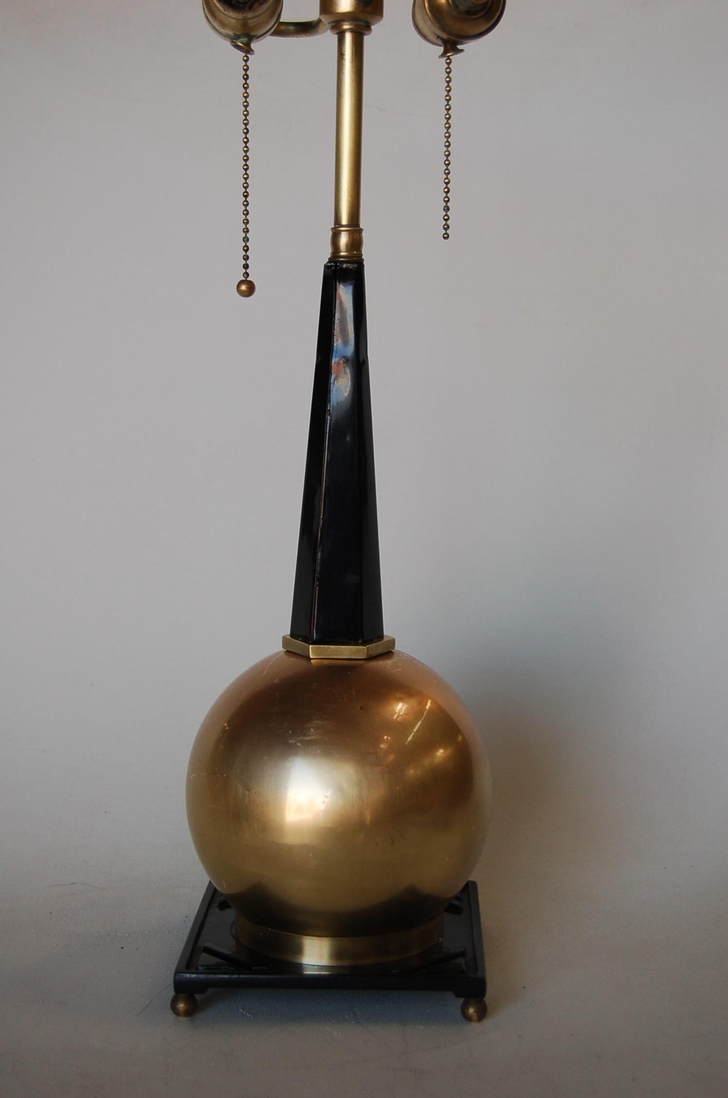 Art Deco Empire style brass with black enamel, ball table lamp with double pull chain by Frankart. 

Measures: 20