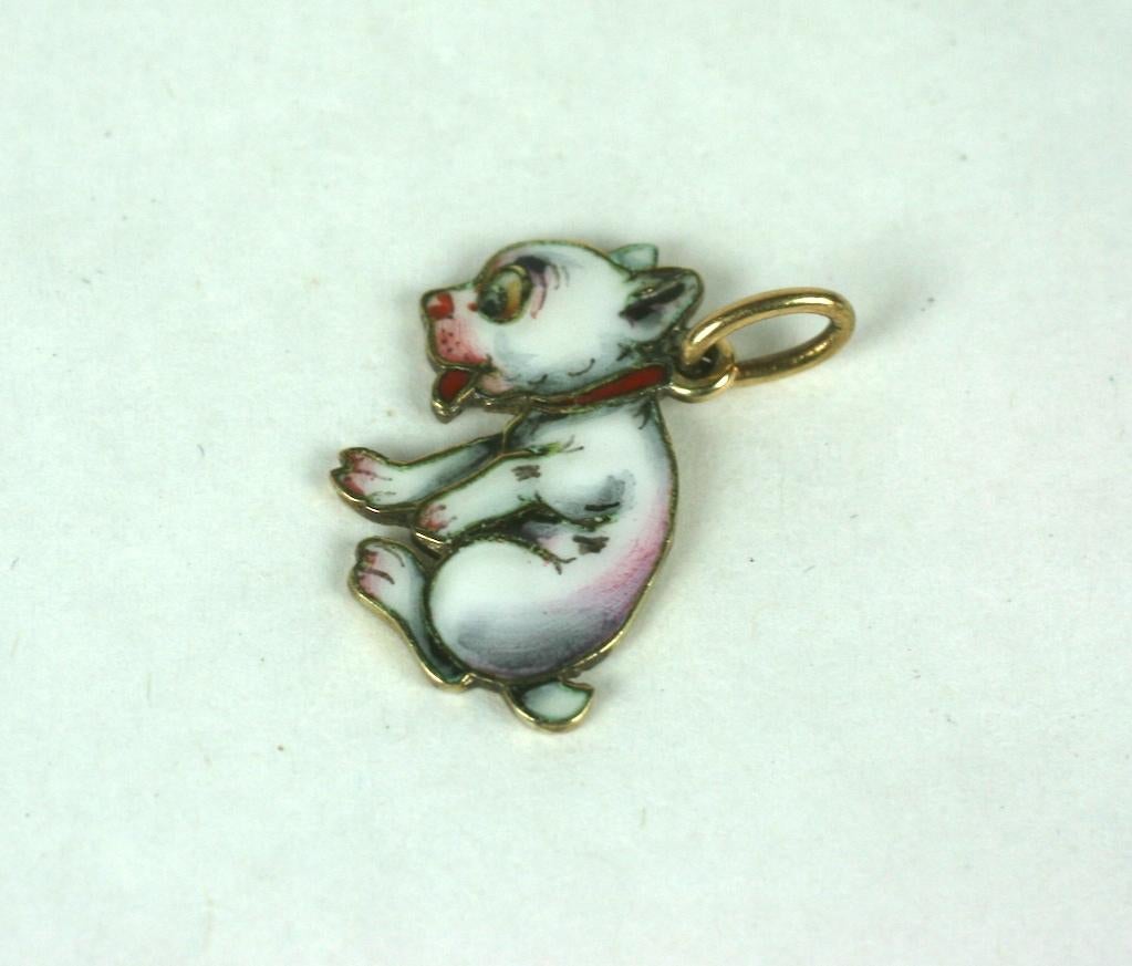 Art Deco Enamel and 14k Gold Puppy Charm. Incredible hand painted detailing from the Art Deco era, the frisky puppy rendered in almost a cartoon like fashion.
Marked 