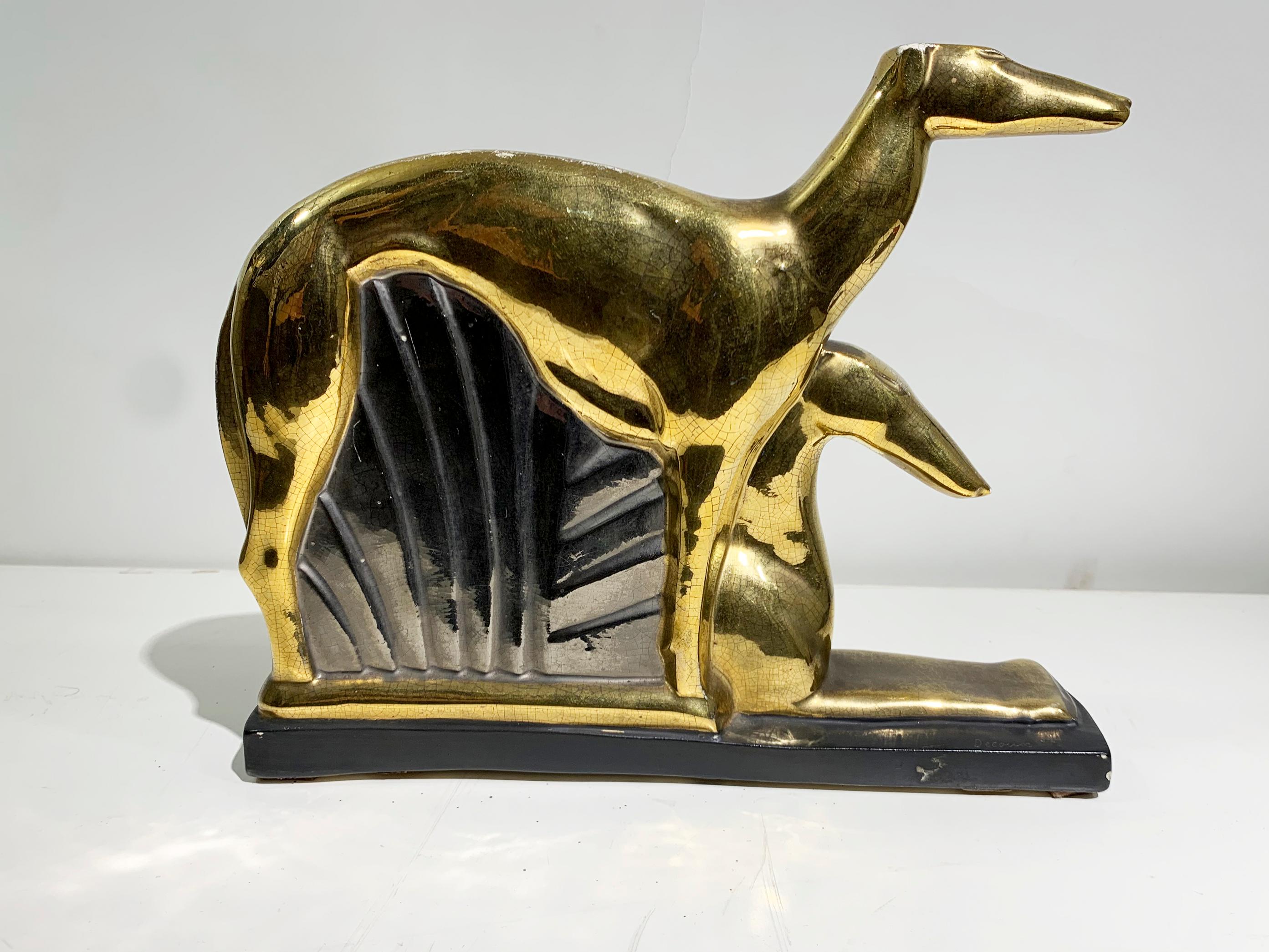 The Art Deco ceramic sculpture by Michel Decoux, signed at the base 