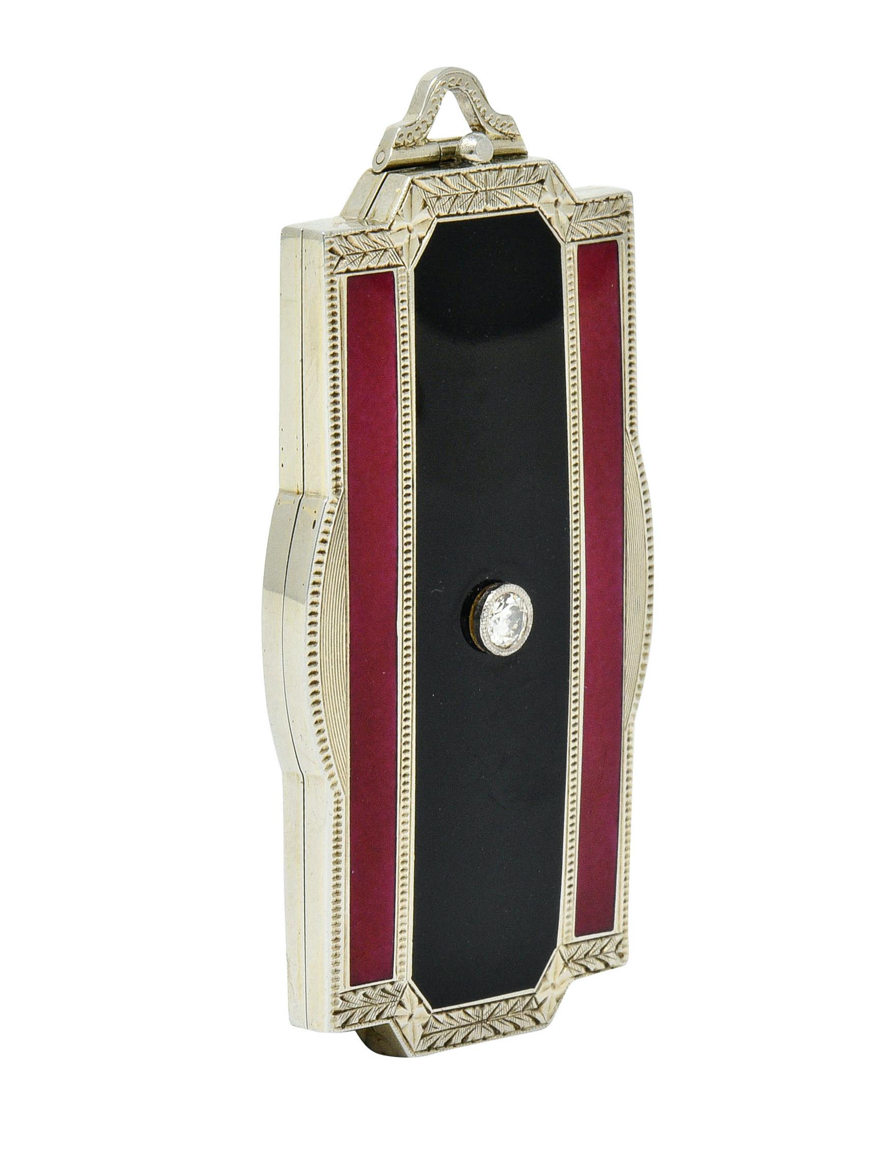 Rectangular locket pendant is glossed by three vertical enamel stripes

Enamel is featured on both front and back, red and black, with no loss and very minor scratches

Front centers a bezel set transitional cut diamond weighing approximately 0.10