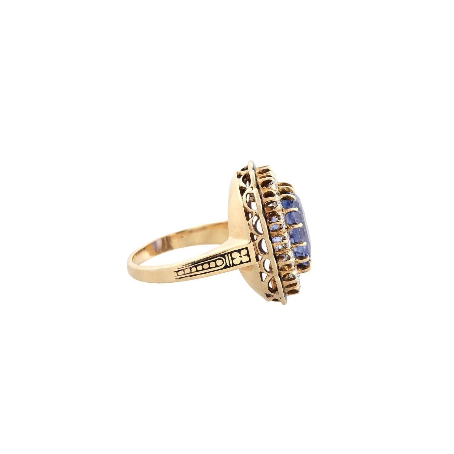An incredible sapphire and diamond ring from the Art Deco (ca1930s) era! Crafted in 14kt yellow gold, this ring adorns a breathtaking natural, no-heat Cushion Cut Ceylon Sapphire. The elongated sapphire exhibits a wonderful cornflower blue hue and