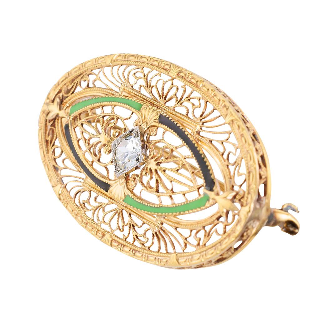Art Deco green and black enamel diamond and yellow gold filigree brooch by Taylor circa 1930.  Love it because it caught your eye, and we are here to connect you with beautiful and affordable jewelry.  Decorate Yourself!  Simple and concise