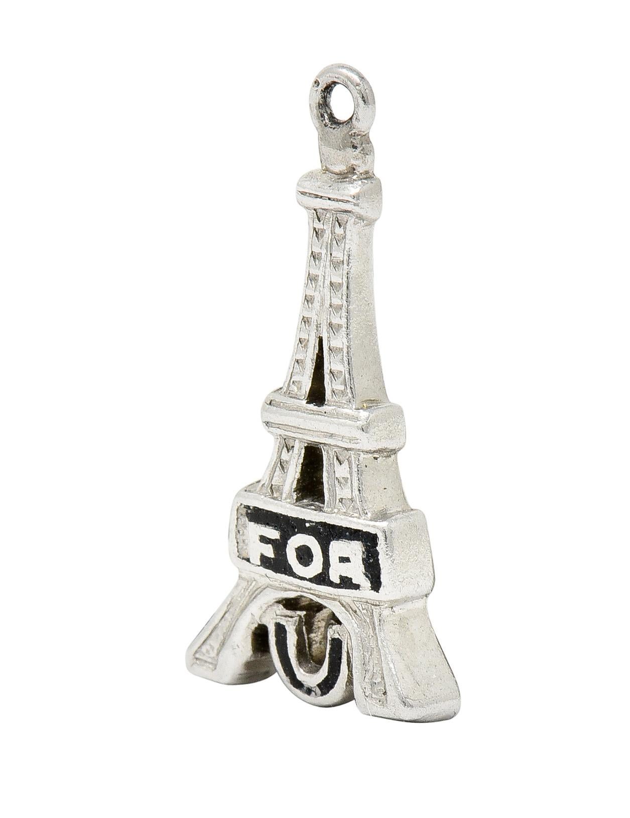 Charm is designed as a highly rendered Eiffel Tower

Featuring the enameled words 'FOR' and 'U', exhibiting some loss; consistent with age, wear, and use

Creating the clever visual pun of 