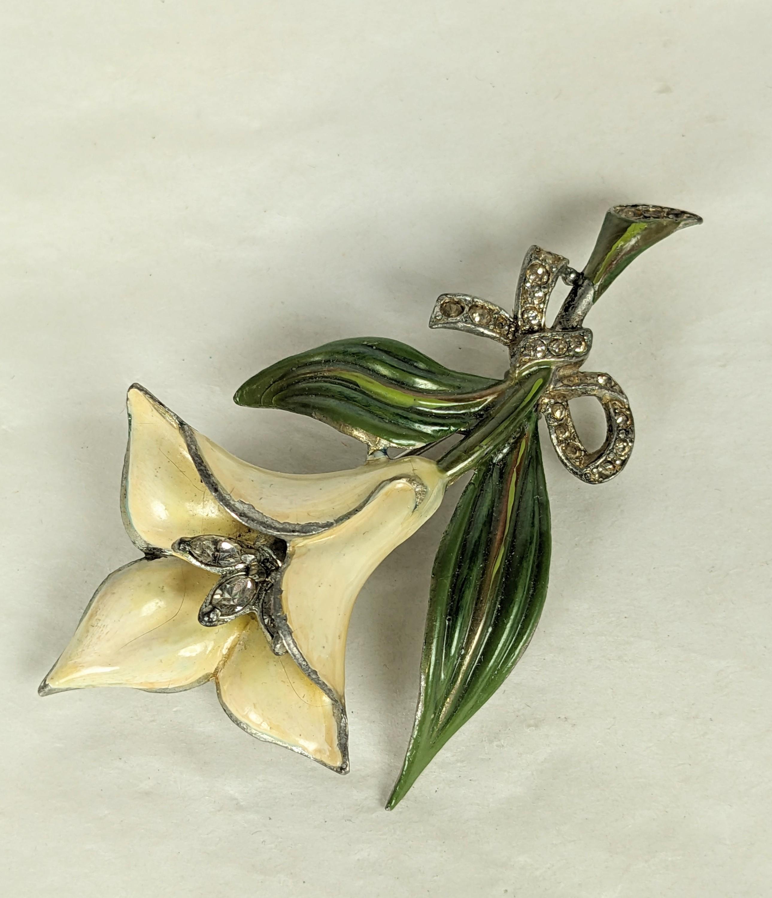 Art Deco Trembler Calla Lilly Brooch hand enameled in the manner of Alfred Philippe for Trifari. Of base metal with crystal pave rhinestone bow knot and marquise trembler. Excellent Condition, Unsigned Coro.
L 2.75