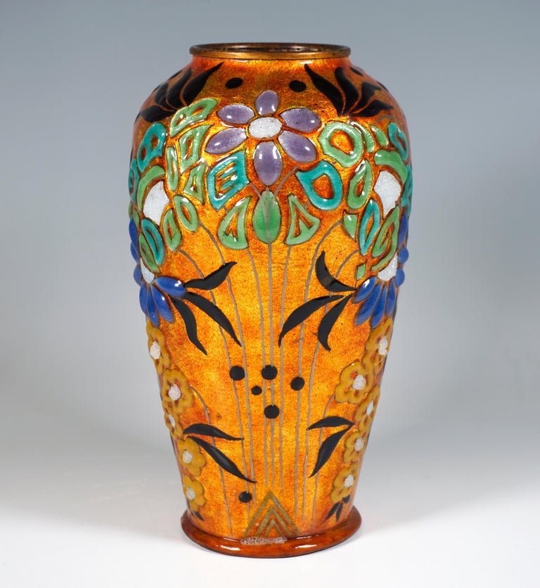 Copper vessel, covered on the outside with silver foil and extensively with orange-colored enamel, and decorated with paste-like applied, symmetrically arranged floral elements, irregularly glazed, gold-painted inscribed 'J Sarlandie Limoges' on the