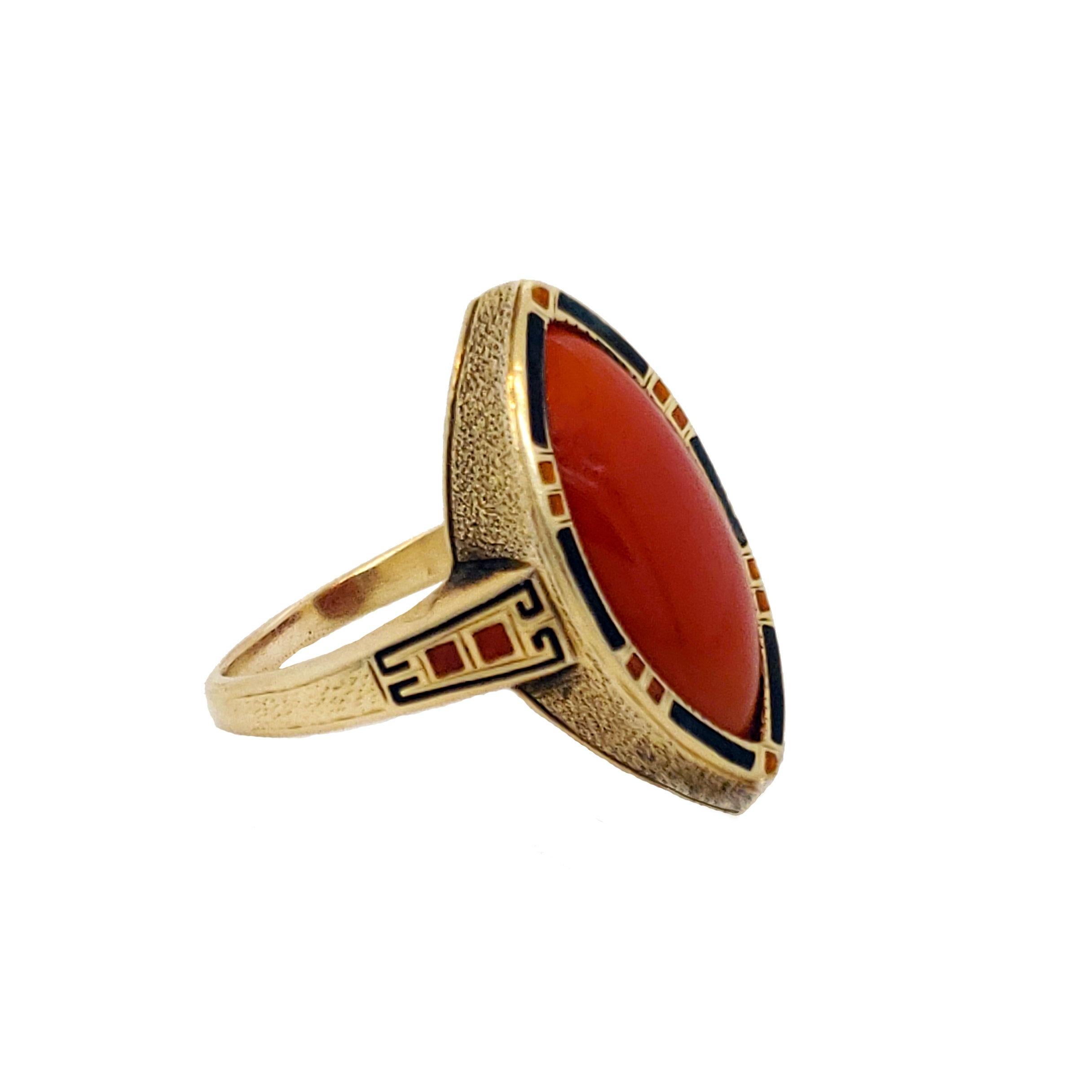 This ring is absolutely stunning! Made of 14K yellow gold and hand painted enamel, this amazing ring boasts a magnificent red coral cabochon! This Art Deco ring dates to about 1925 and red and black enamel on the border, perfectly complimenting the