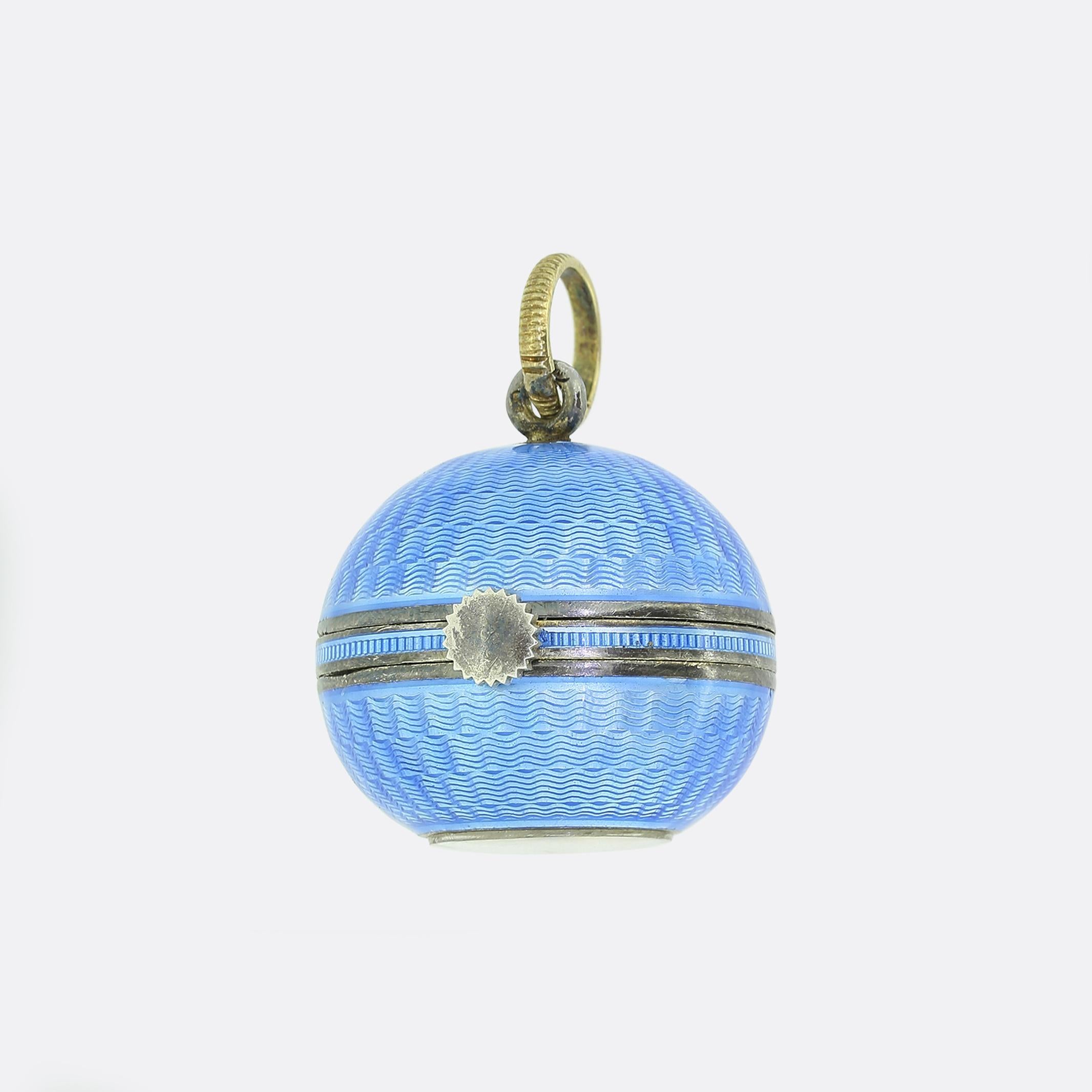 Here we have an gorgeous watch fob crafted during the pinnacle of the Art Deco movement. This sterling silver piece takes on a spherical form with the entire exterior being expertly guilloché enamelled in a poignant medium blue colour tone with a
