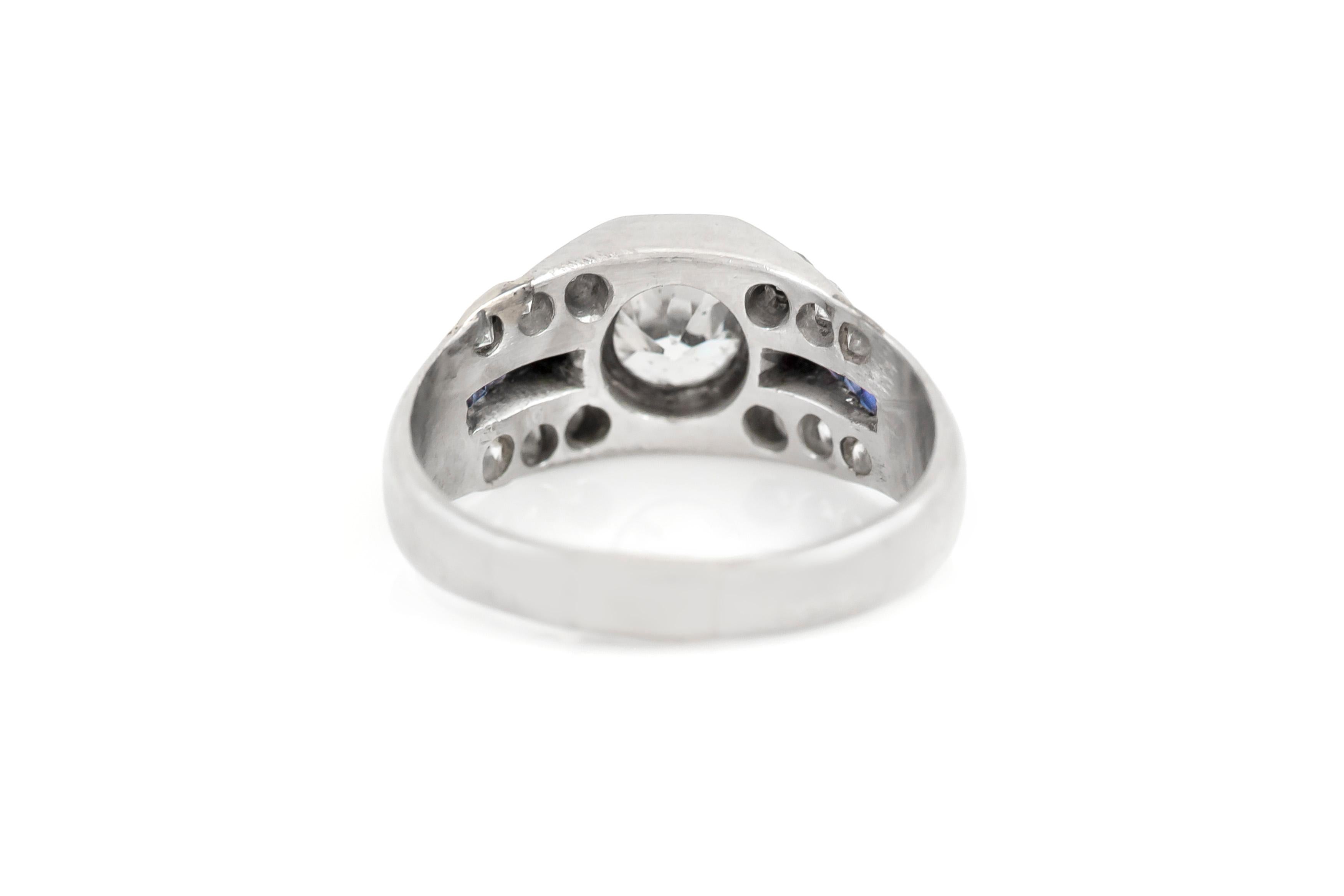 The ring is finely crafted in platinum with sapphire and diamonds weighing approximately 1.00 carat.