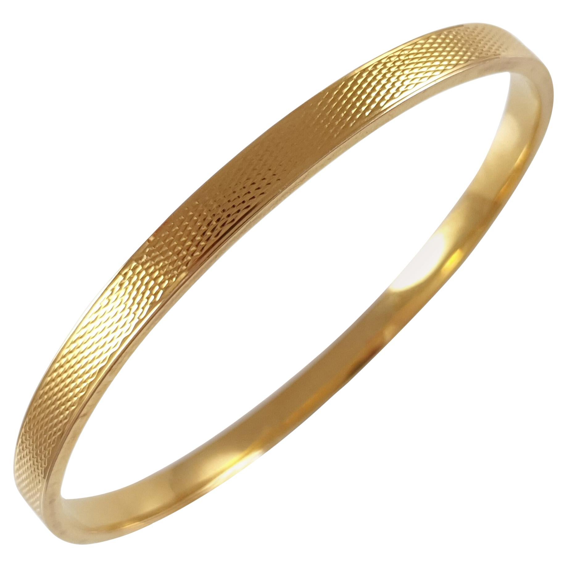 Art Deco Engine Turned 15 Karat Yellow Gold Flapper Bangle, London, 1927