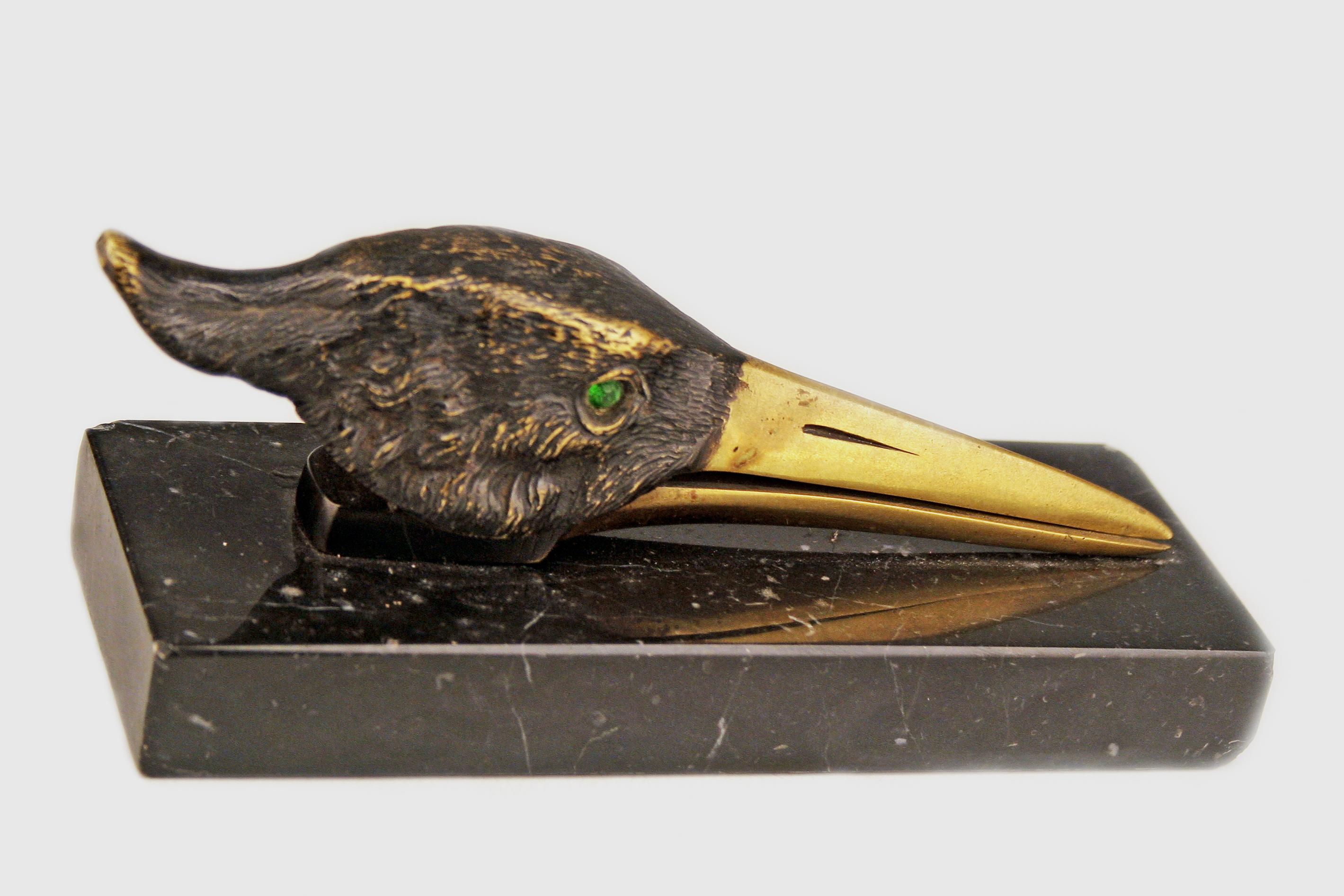 Art Déco english patinated bronze papper clip/letter holder depicting a stork head with marble plinth

By: unknown
Material: bronze, marble, copper, metal
Technique: cast, patinated, painted, metalwork, molded
Dimensions: 5 in x 2 in x 2.5 in
Date: