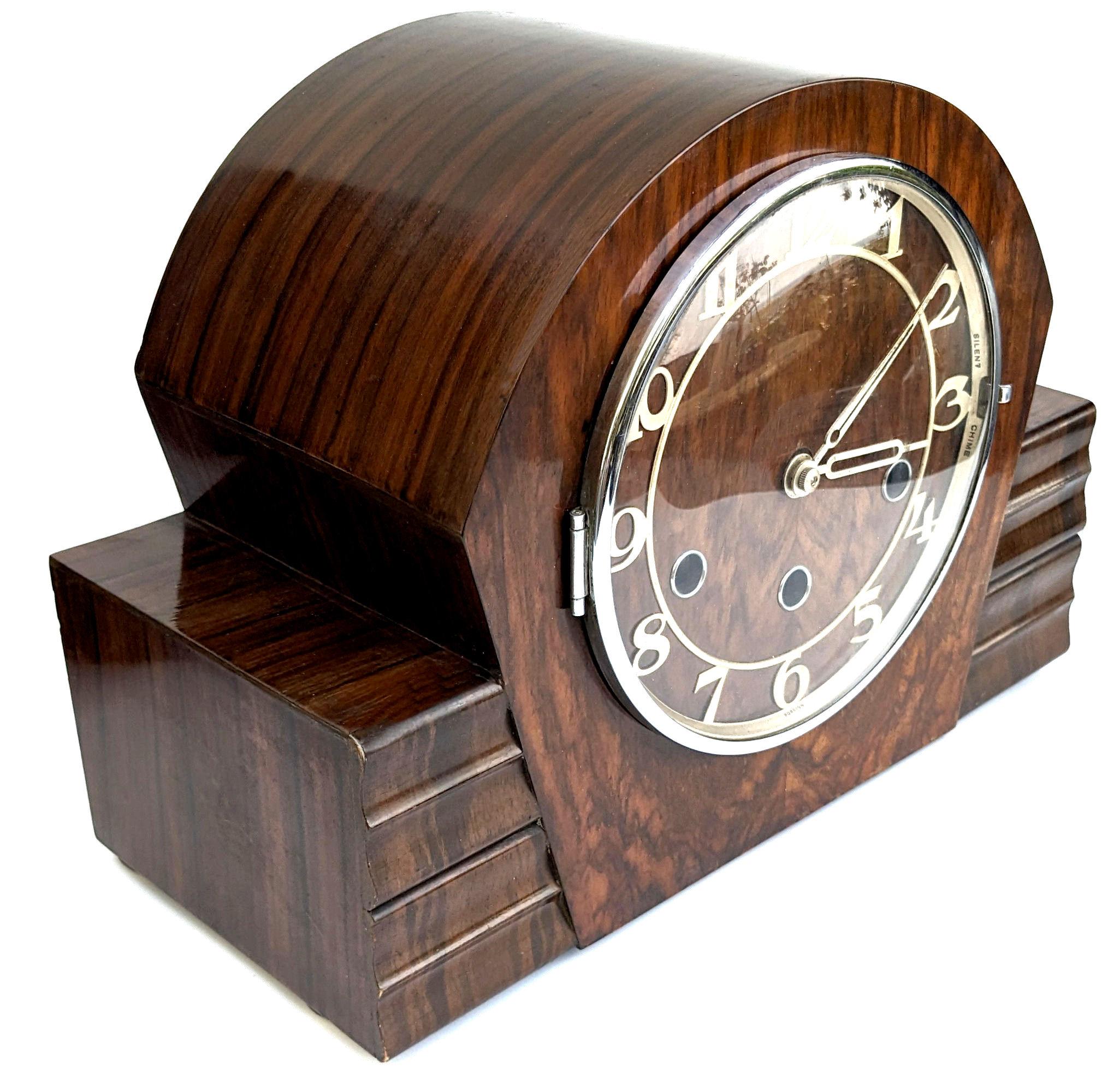 For your consideration is this rather stylish Art Deco mantel clock manufactured with an 8 day movement, comes with original key and pendulum . The original instruction label can be seen on the inside back door and denotes the sale of the clock of