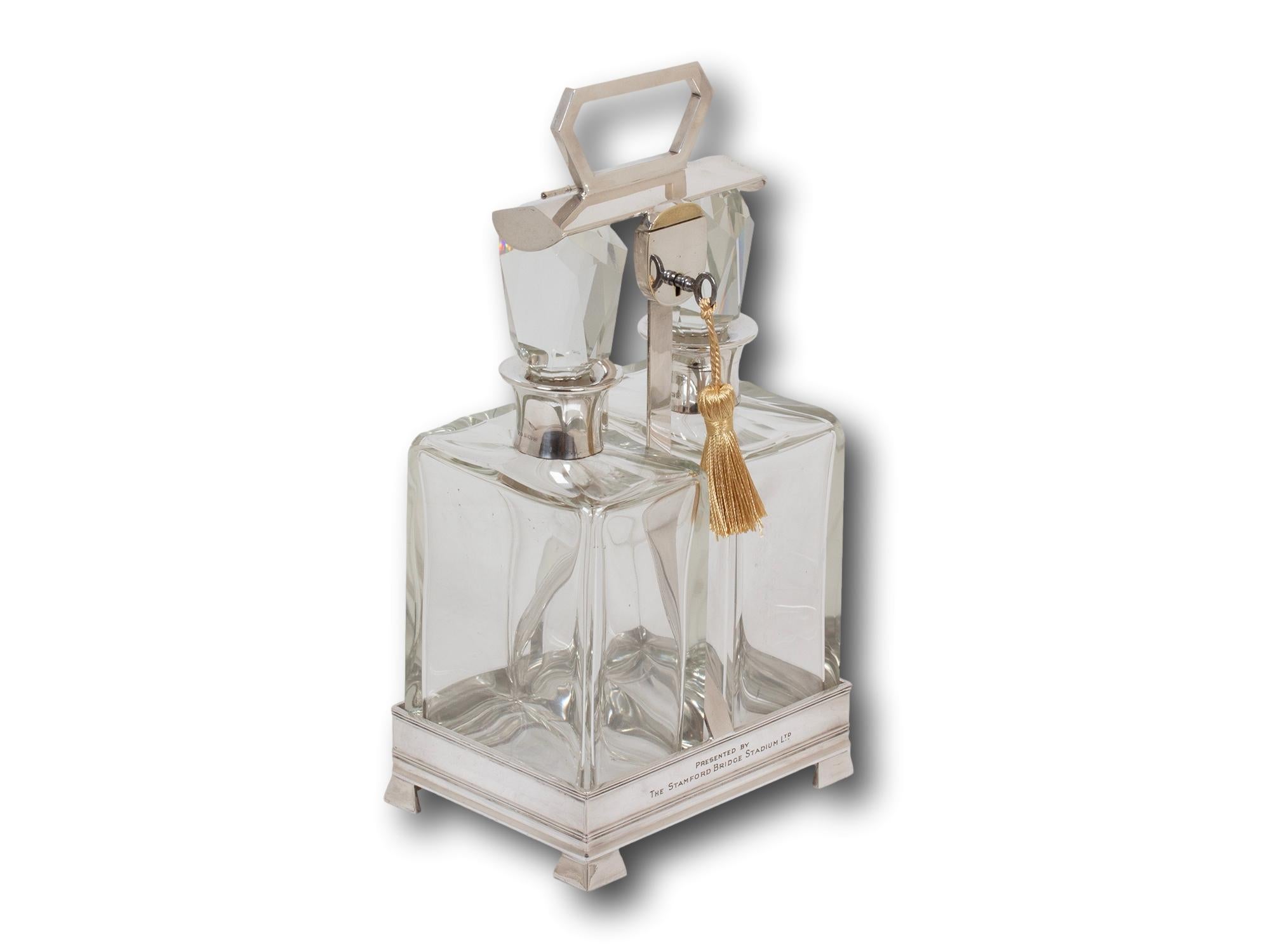 Silver Hallmarks for 1937 Art Deco

From our Tantalus collection, we are delighted to offer this Art Deco Stamford Bridge Tantalus by Hukin & Heath. The Tantalus modelled with two decanters locked into place by a silver plate frame raised upon four