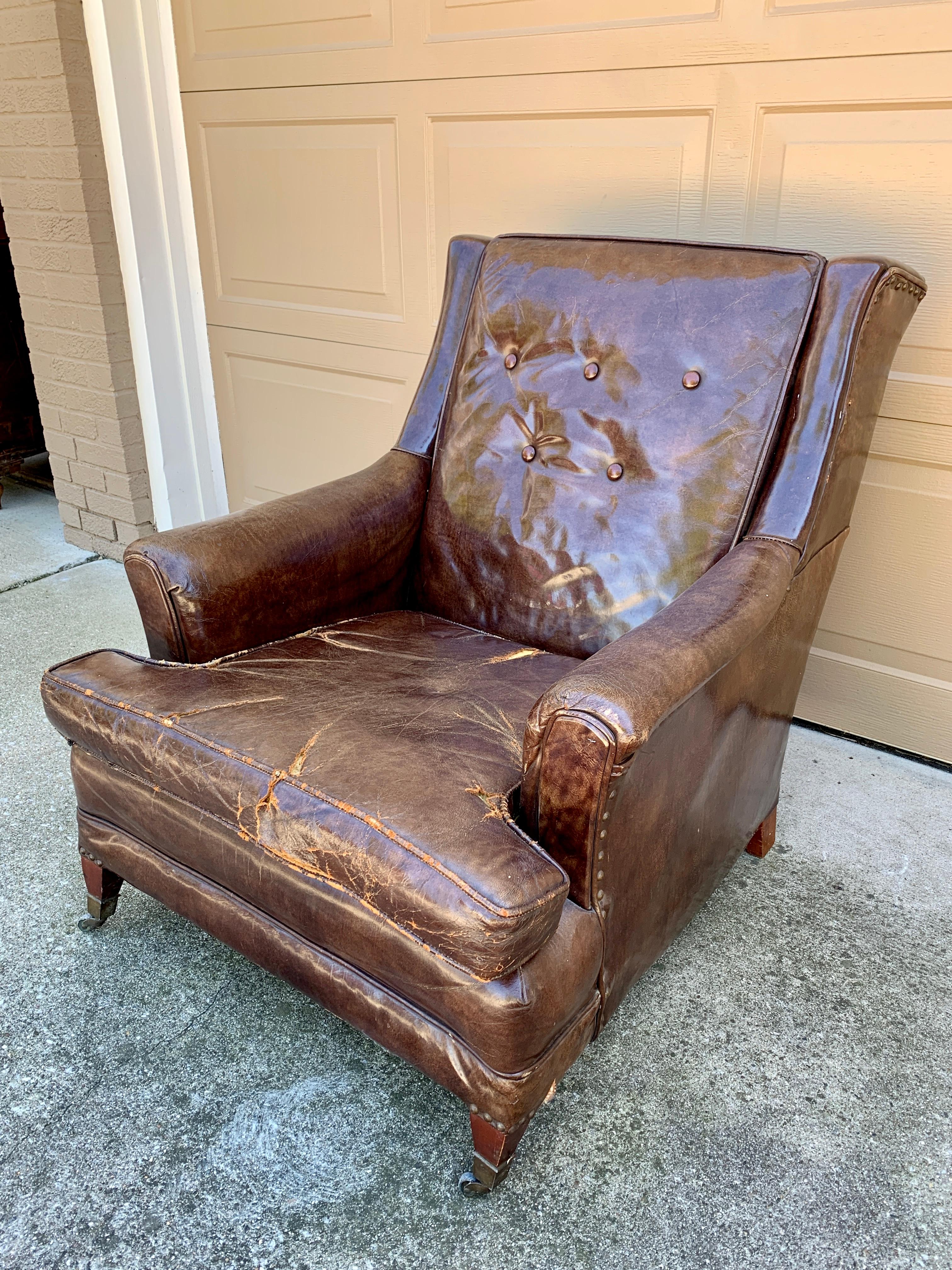 A stunning Art Deco leather club chair or armchair. Just imagine the stories this chair has heard! This piece would be perfect in a den, library, or lounge. It's the epitome of English country style. 

England, Circa 1930s

Measures: 29.5