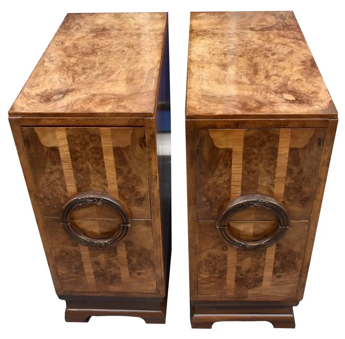 Fabulous pair of matching 1930's English  Art Deco bedside tables/nightstands  in heavily figured walnut veneer with contrasting walnut feather banding to the centre creating a fabulous geometric effect. Two generously sized drawers to each cabinet