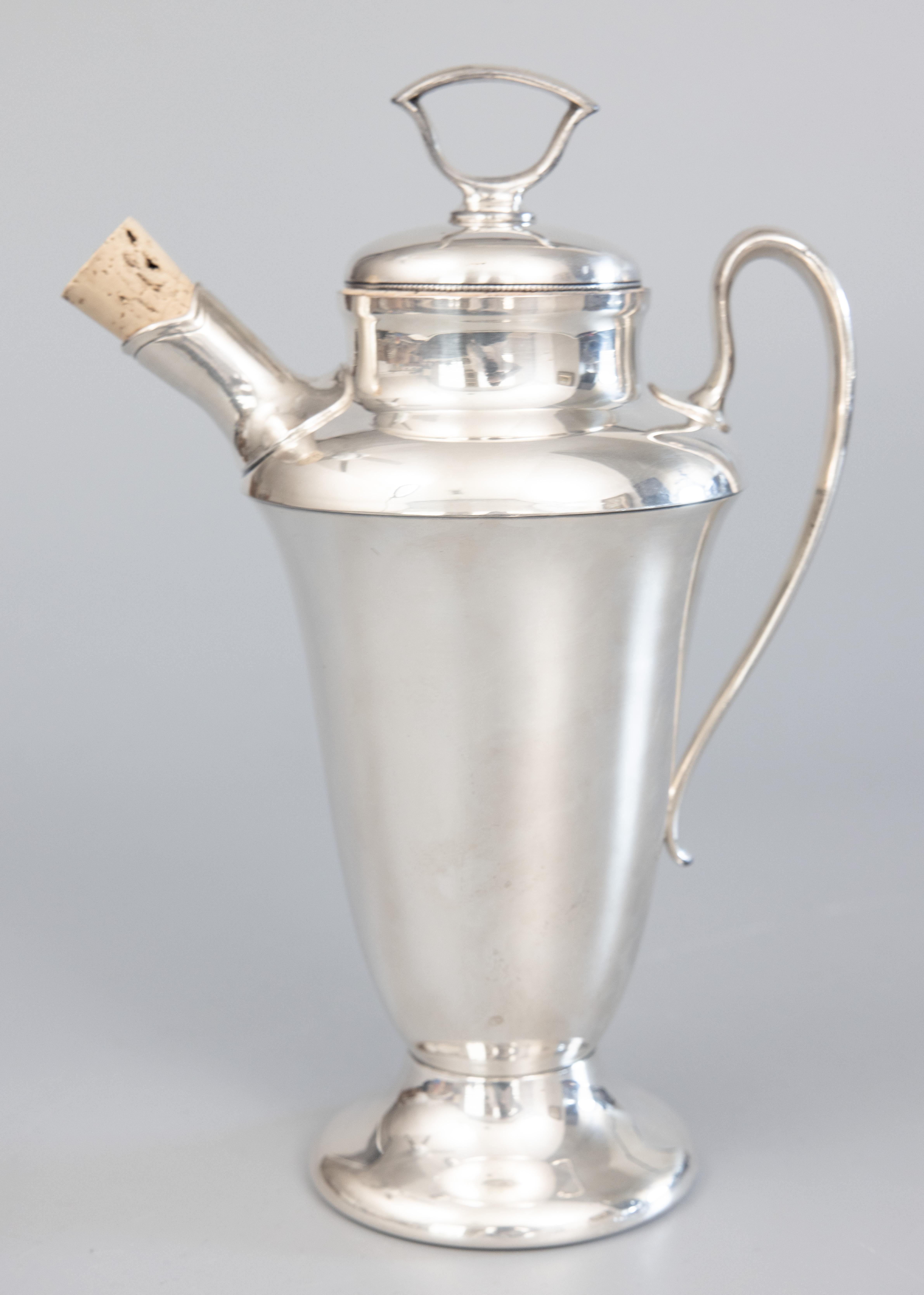 A sleek and stylish 1920s Art Deco English silverplate cocktail or martini shaker with removable cap and cork. Hallmarked on reverse. It's decorative and functional, perfect as a gift or for your next party.

