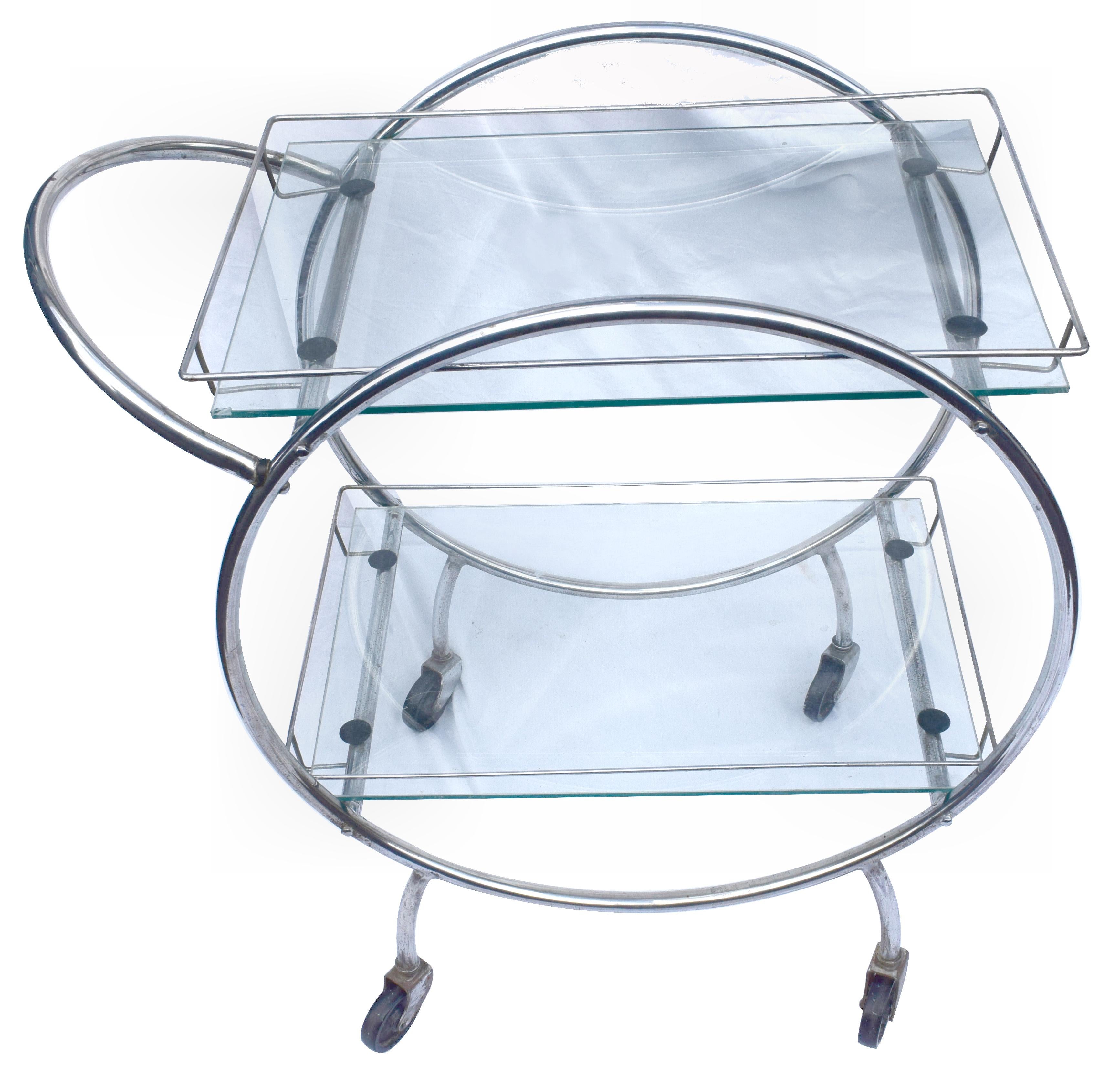 Stylish English two-tier Art Deco chrome and glass drinks Hostess trolley bar cart. Dating to the 1930s and if glam is your thing then this is for you! In situ these carts look nothing less than superb. Can be used for serving or just displaying