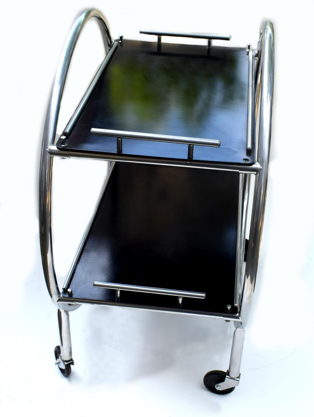 Stylish English 1930s Art Deco two-tier chrome and black laminate drinks Hostess trolley bar cart. If glam is your thing then this is for you! In situ these carts look nothing less than amazing. Can be used for serving drinks or just displaying your