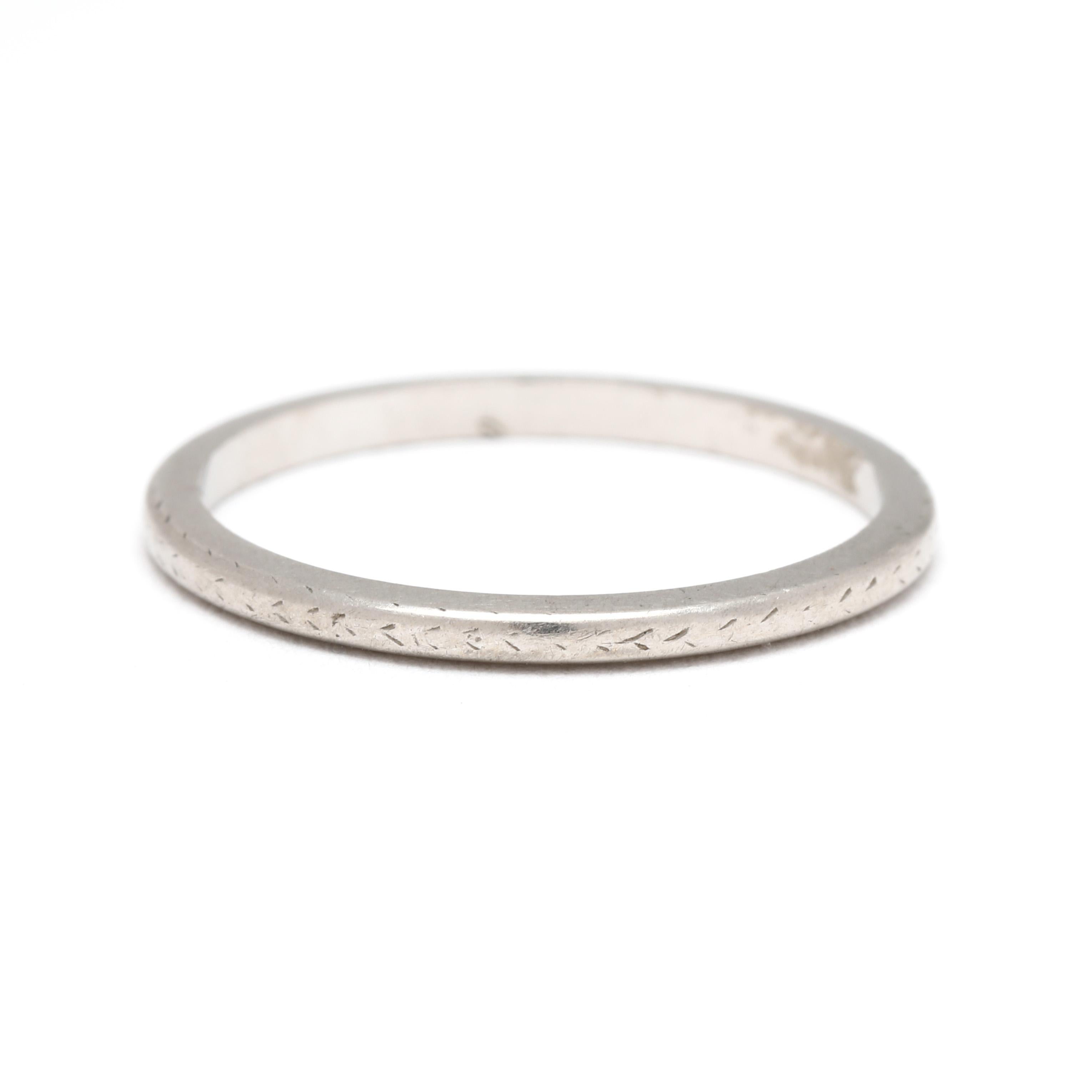 Step into the elegance of the past with this stunning Art Deco engraved band ring, crafted in luxurious platinum. Featuring intricate geometric and floral engravings, this size 5.25 ring captures the timeless beauty of the 1920s. Perfect as a