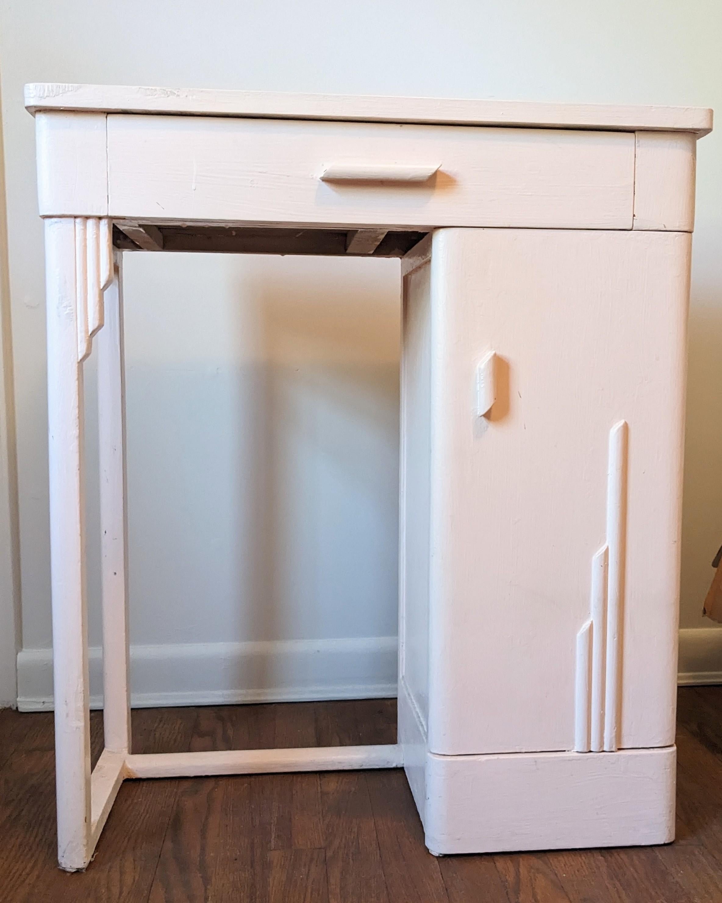 Charming Art Deco Wood Entry Desk from the 1930's. Top drawer with additional side door storage. Decorated with applied stepped designs throughout. Repainted pink later in the 20th Century. 1930's USA. 