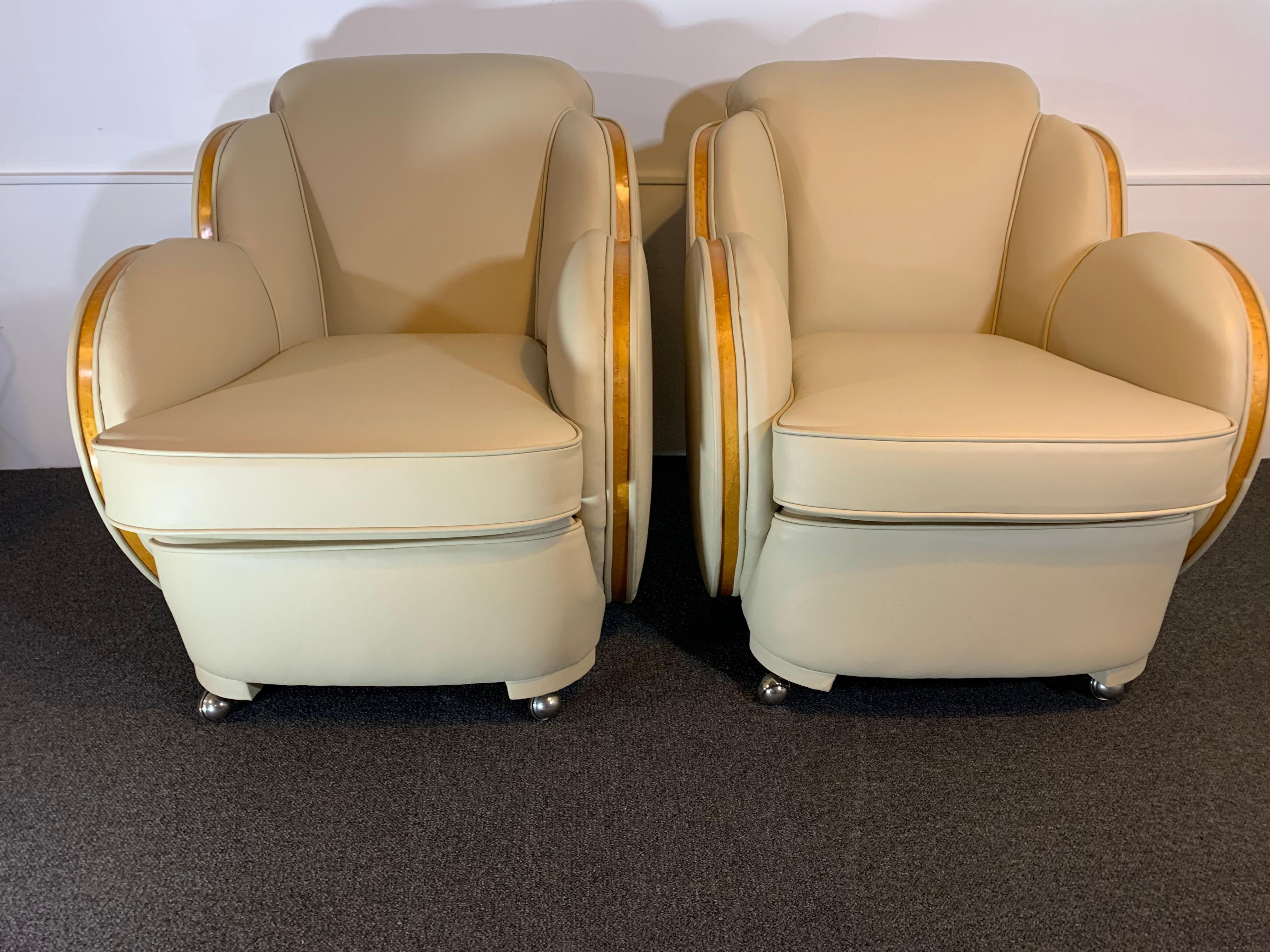 Art Deco cloud 3-seat sofa and two armchairs by Harry and Lou Epstein.
This has been reupholstered in a soft cream Italian leather and has a satinwood banding to the arms.
In showroom condition.

Dimensions:
Height 86 cm (33.9