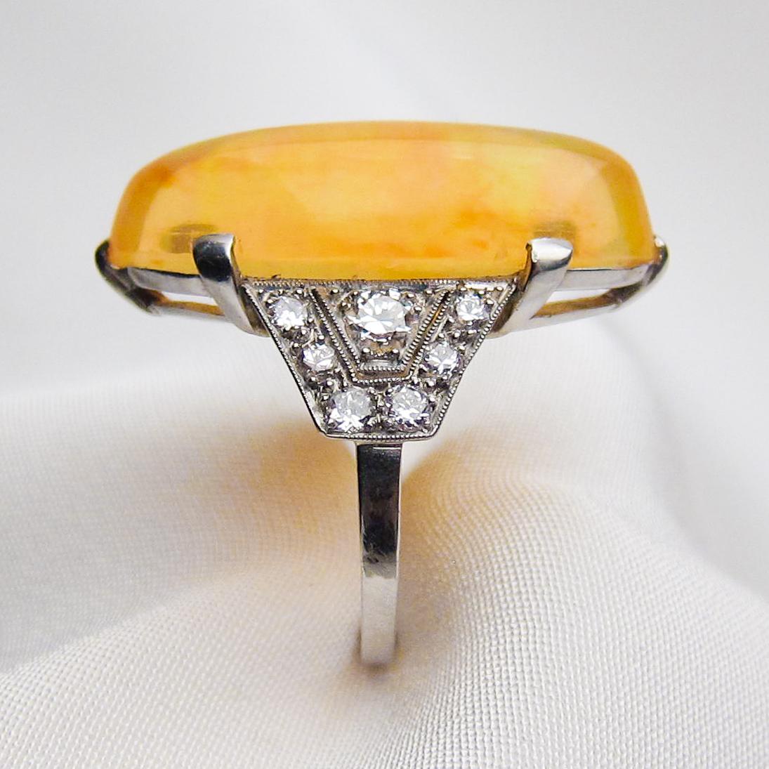 Art Deco Era 14.75 Ct Orange Ethiopian Opal Cabochon and Diamond Platinum Ring In Excellent Condition In Seattle, WA