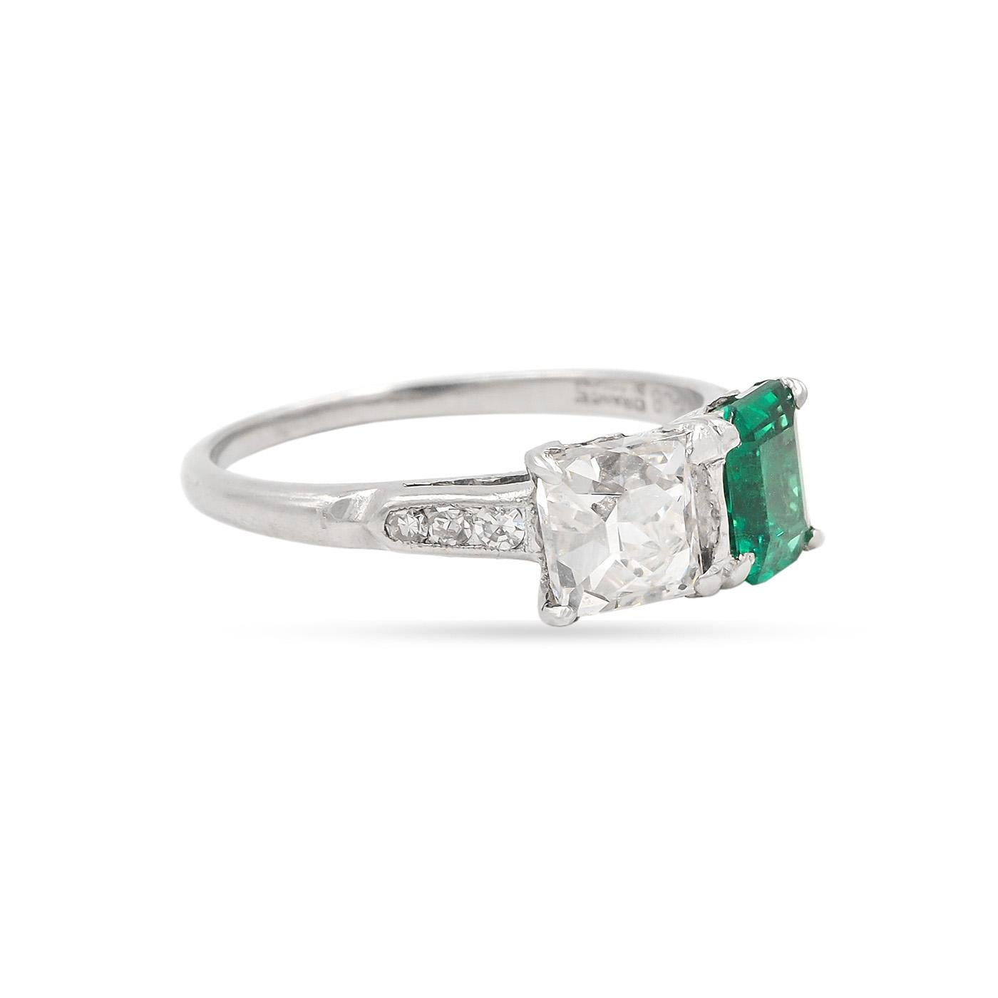 Original Art Deco era French Cut Diamond & Emerald Toi et Moi Engagement Ring composed of platinum. The French Cut diamond is 1.51 carats, GIA certified H color/SI2 clarity. The AGL certified Emerald Cut Natural Colombian Emerald is 1.02 carats.