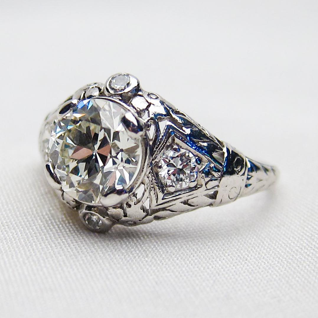 Women's Art Deco Era 1.74 Ct Transitional-Cut Diamond Platinum Filigree Engagement Ring For Sale