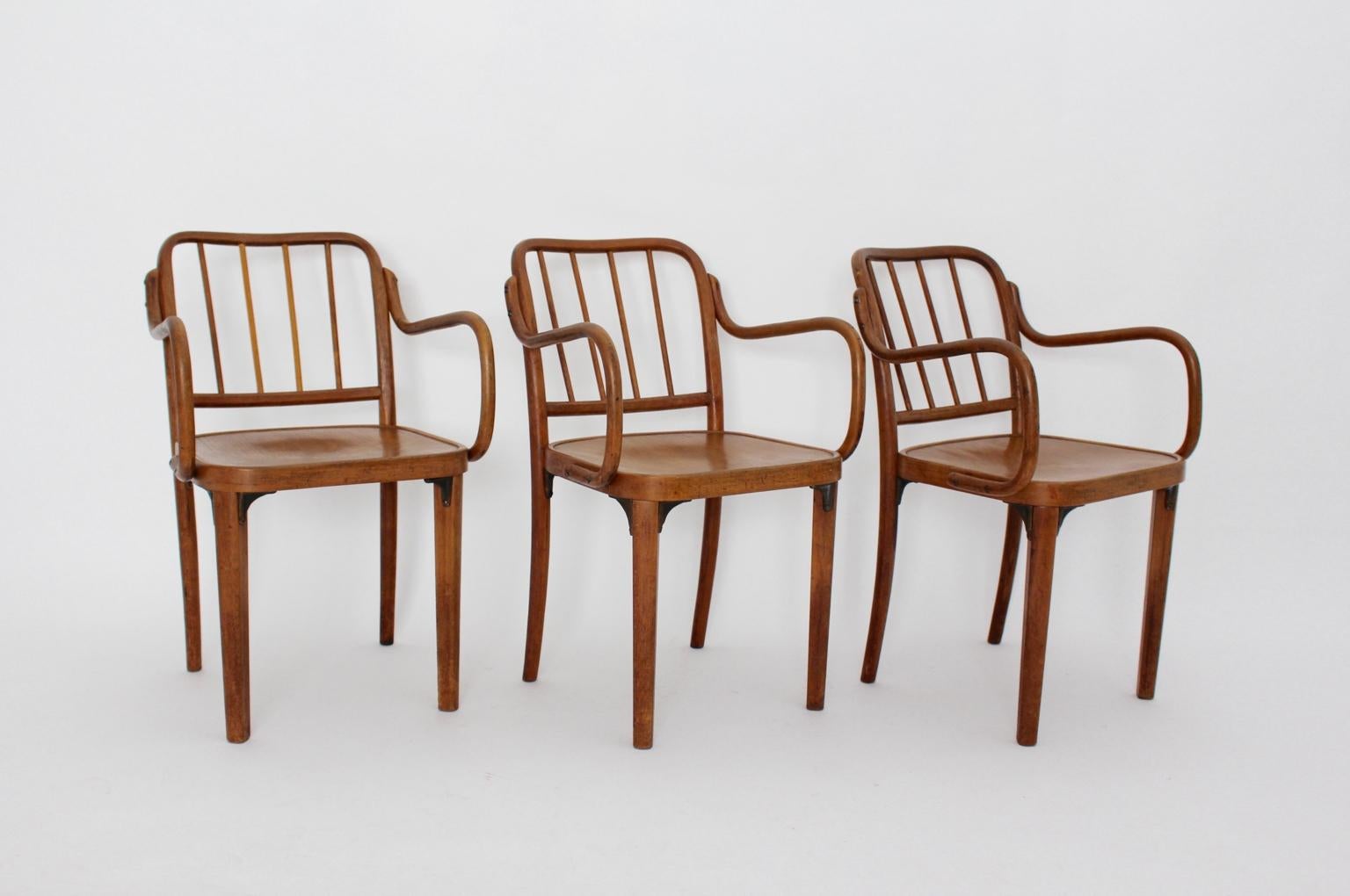 Art Deco three armchairs from oak and plywood in by Josef Frank attributed and executed by Thonet Vienna, 1930s.
The frame of the chairs from oakwood with plywood seats, connected with cast iron elements.
Lacquered and in good condition, ready to