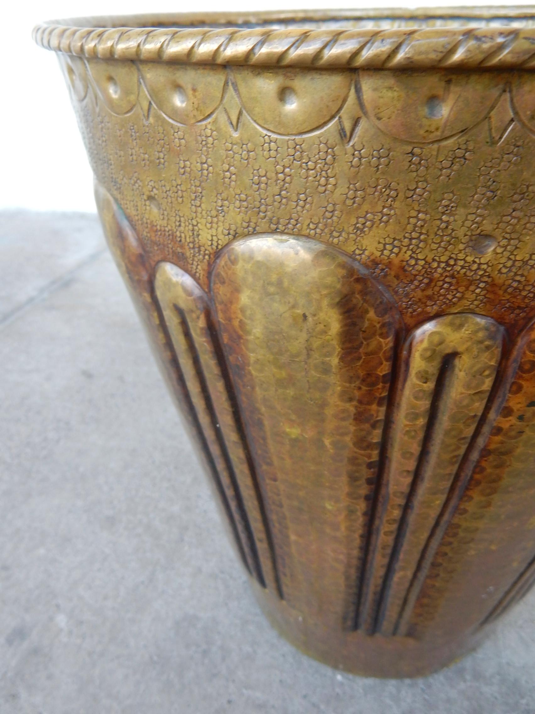 Hand-hammered brass cachepot with the most amazing aged patina, circa 1940s.
Fine quality artisan piece. Stamped on bottom as pictured.
Stands 14