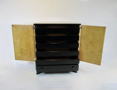 Art Deco era black lacquer gentleman's chest with burl front doors and top