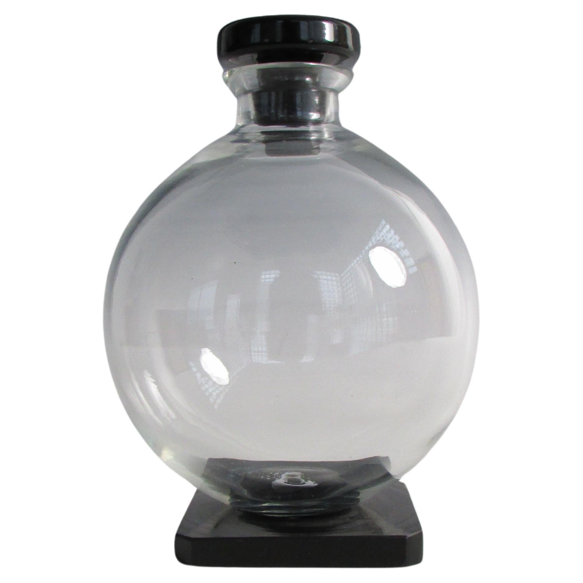 Jarra esférica de cristal transparente de la época Art Déco con base y tapón de cristal de ónice