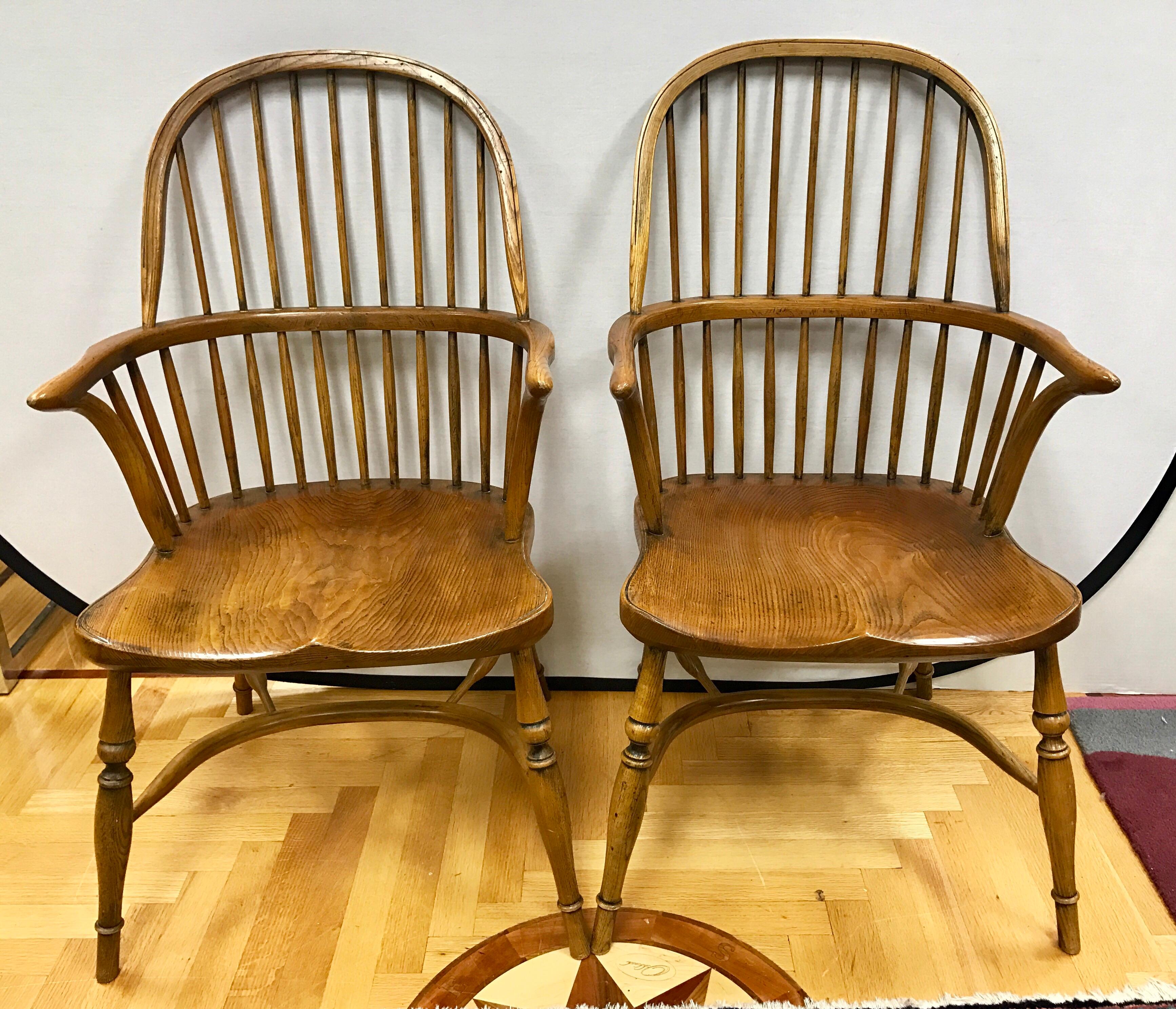 Set of six (two arm, four side) Windsor chairs stamped 