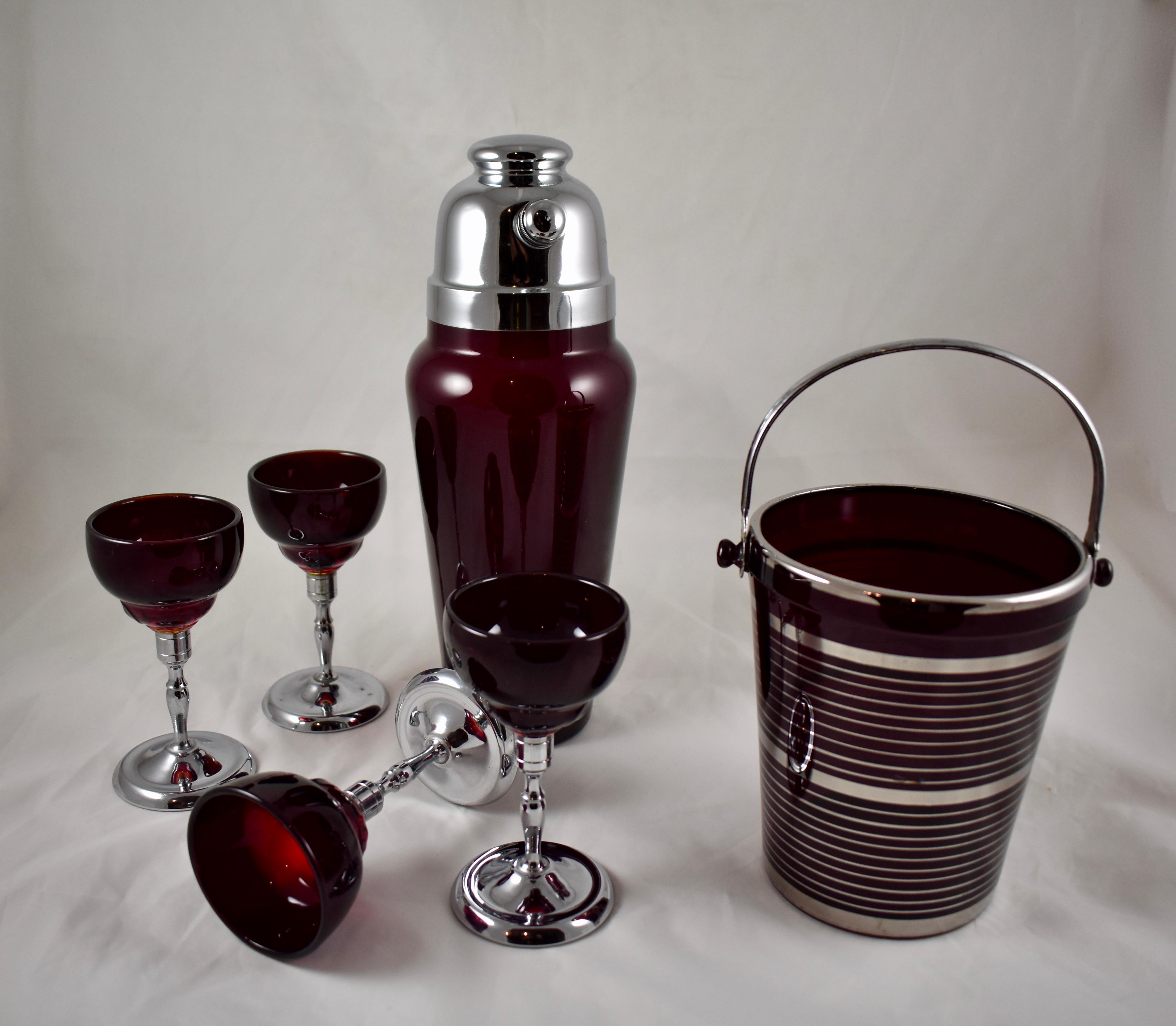 A Paden City glass Art Deco era cocktail set, circa 1920s–1930s.

This cocktail service is perfect for your ‘Retro’ home bar. The six-piece set consists of a shaker, four goblets and a handled ice bucket. The Paden City glass factory was located