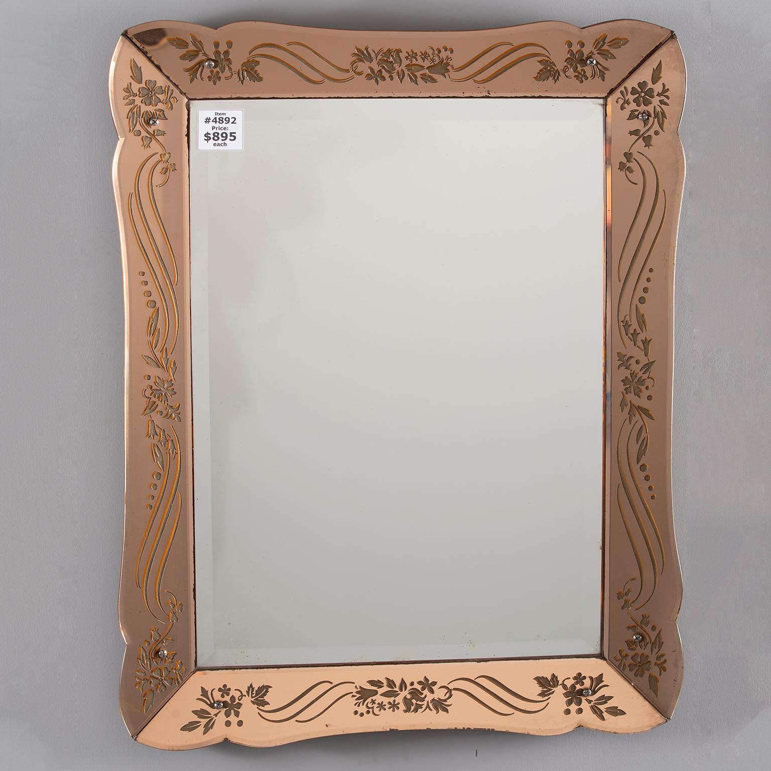 Rectangular Art Deco mirror in pale apricot shade with reverse etched details on frame, circa 1930s. Can be hung either horizontally or vertically. Unknown maker.  Actual Mirror Size:  26.5” h x 19” w
    