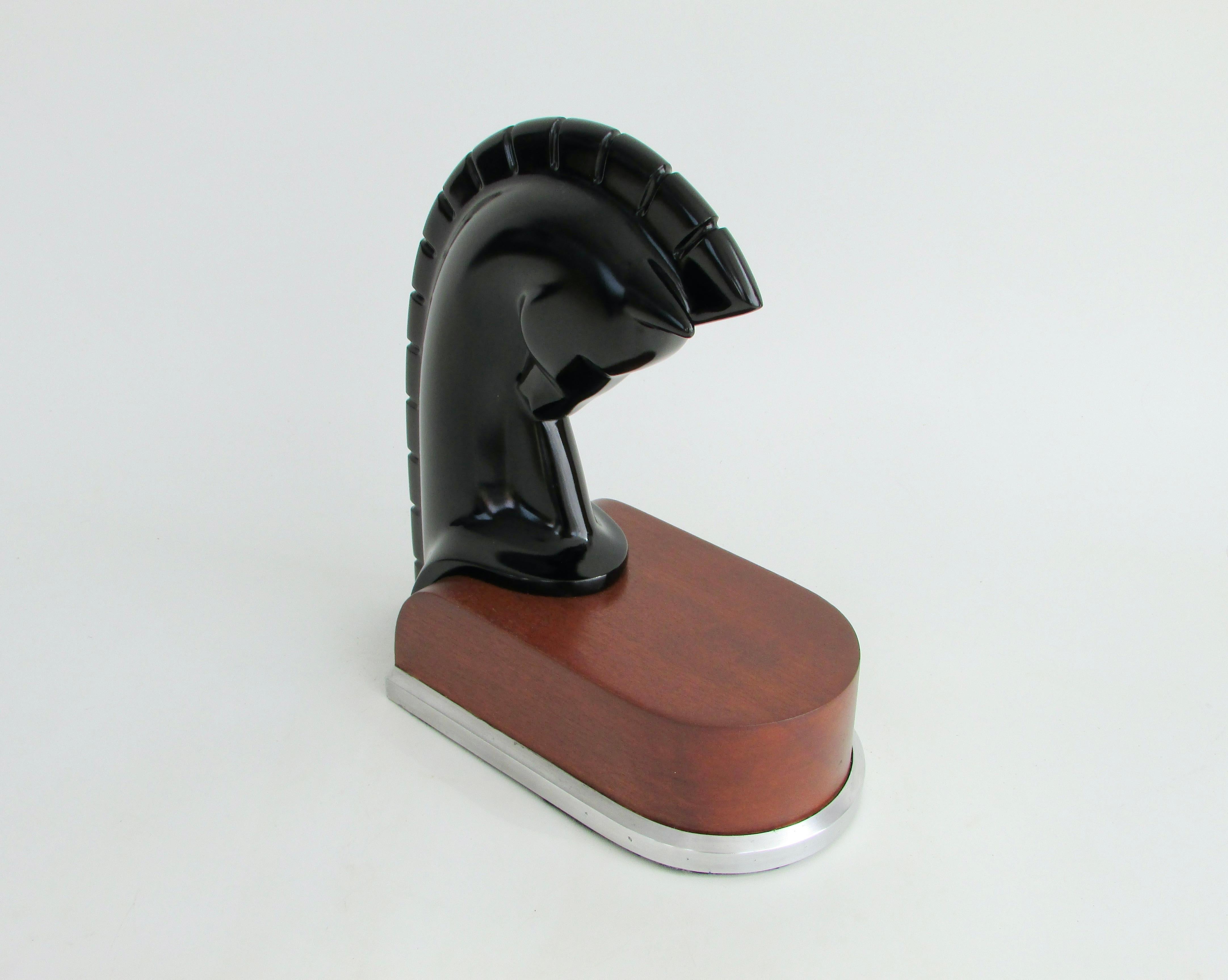 Nicely done stylized horse head sculpture in black lacquer . Sculpture sits on streamlined wood base trimmed in aluminum . 