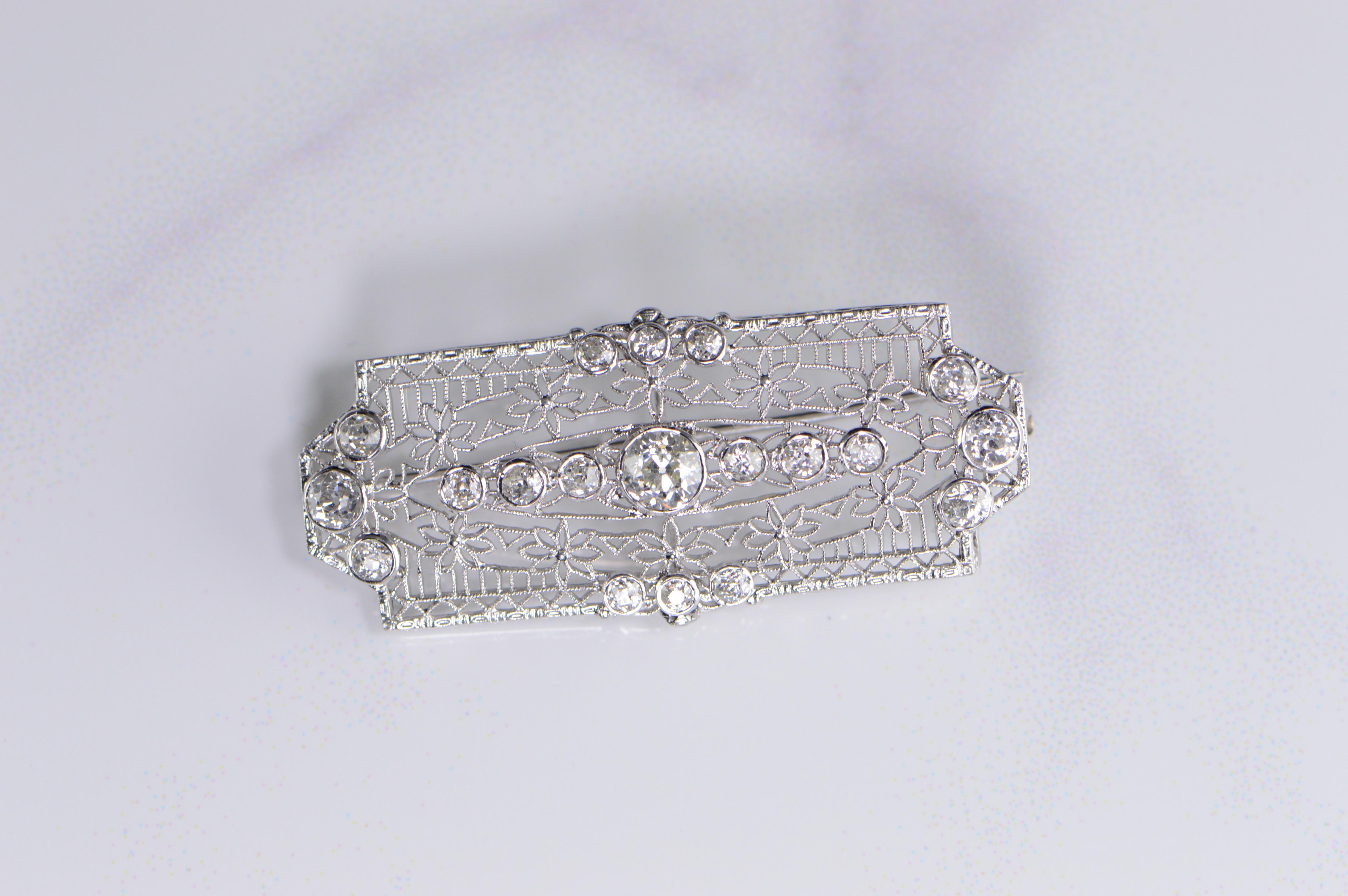 Art Deco Eruopean Cut Diamond Filigree Brooch with 1.68 carat total weight, the center stone is roughly 1/2 carat. Very few inclusions crafted in 14k white gold from the 1920's-1930's weighing 5.2 grams total 